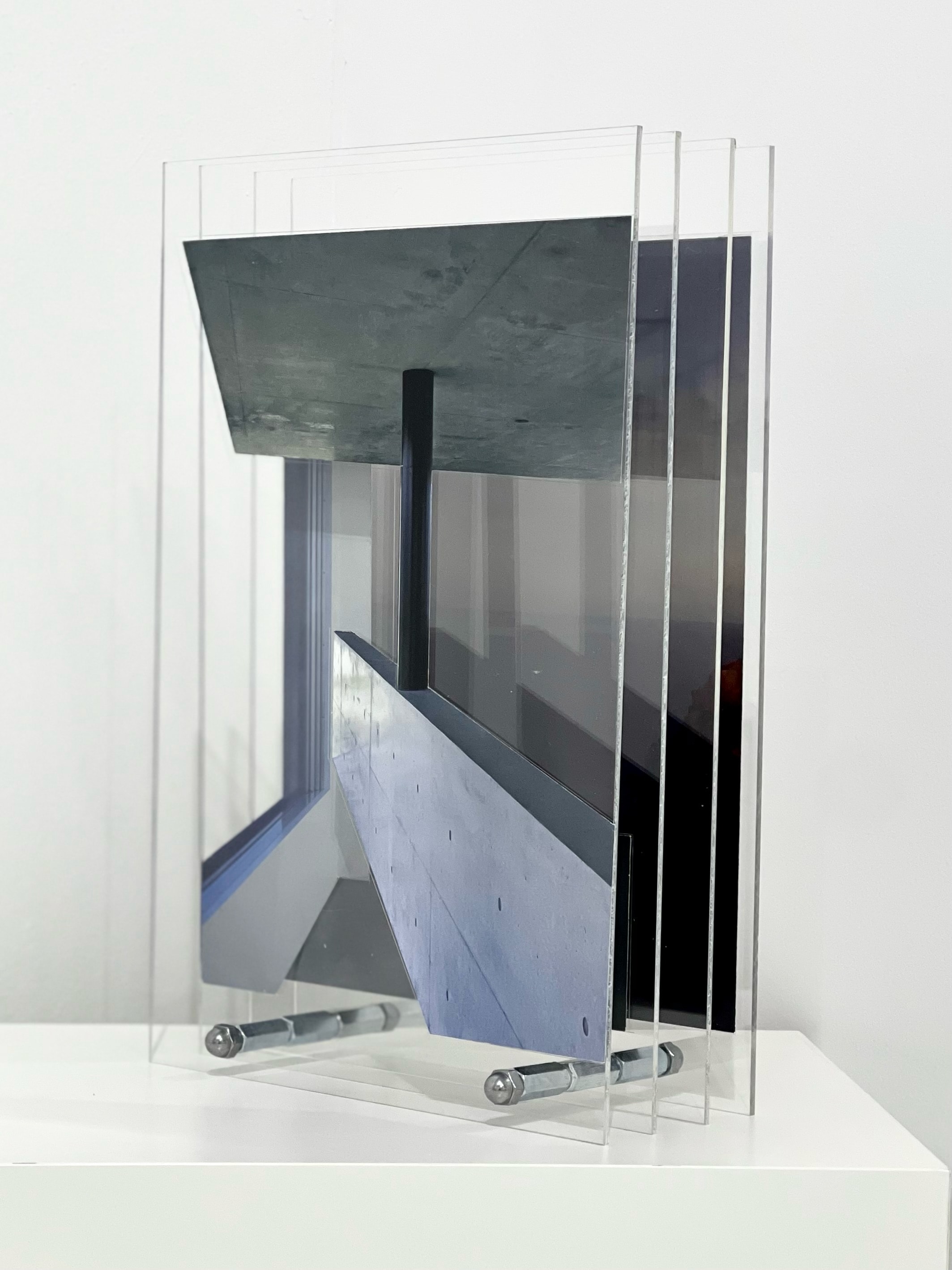 A picture of a mirror on a white table.