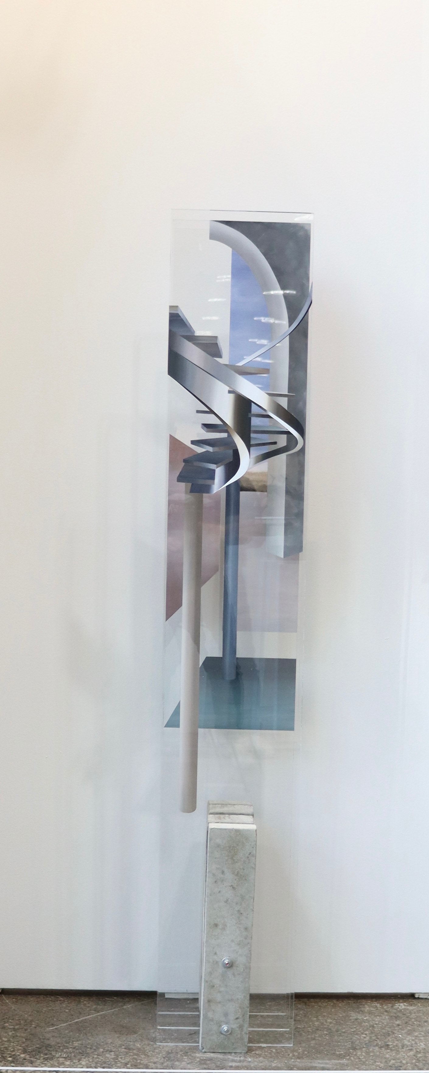 A picture of a sculpture on a pedestal in a room.