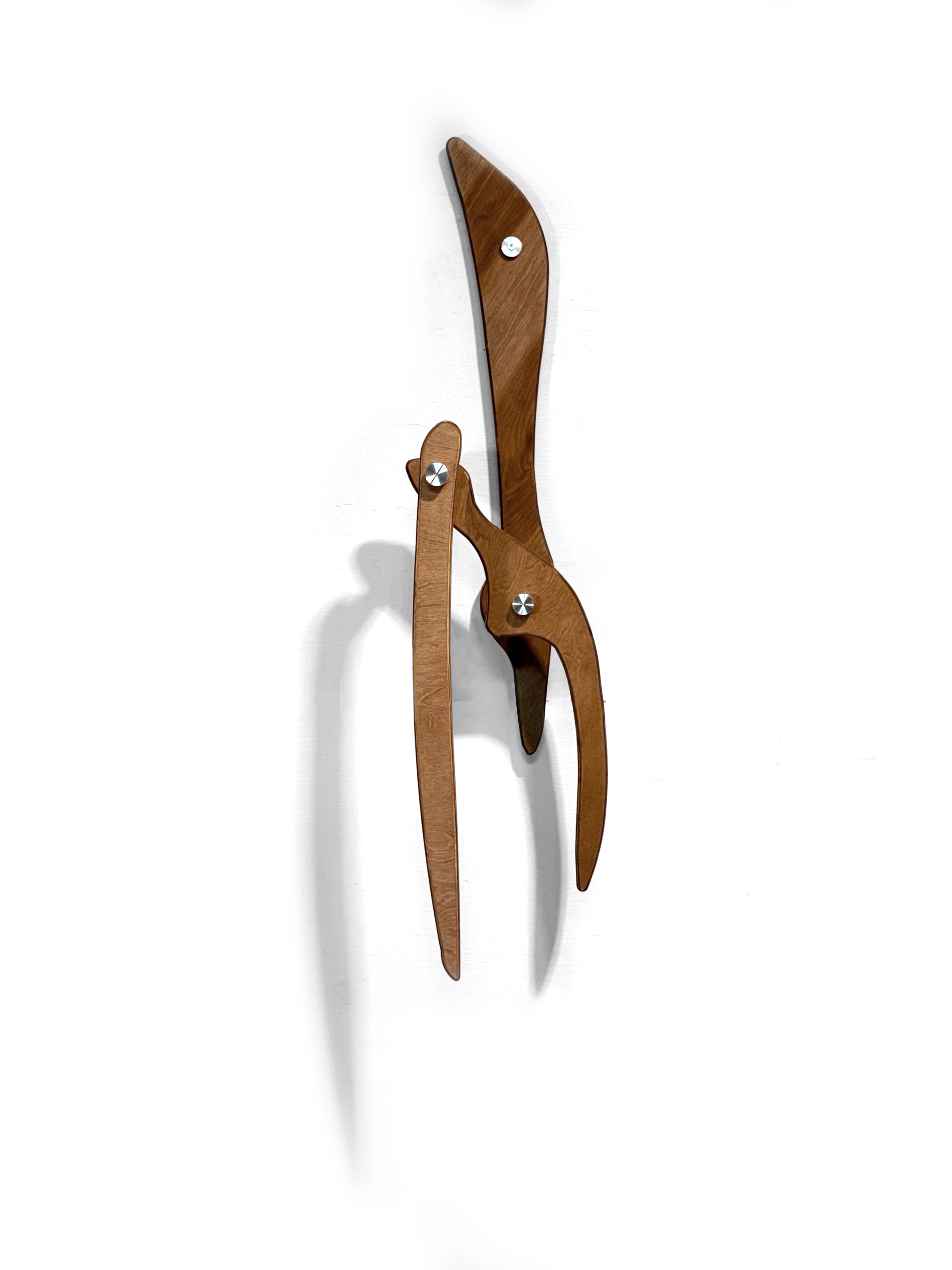 A pair of scissors sitting on top of a white surface.