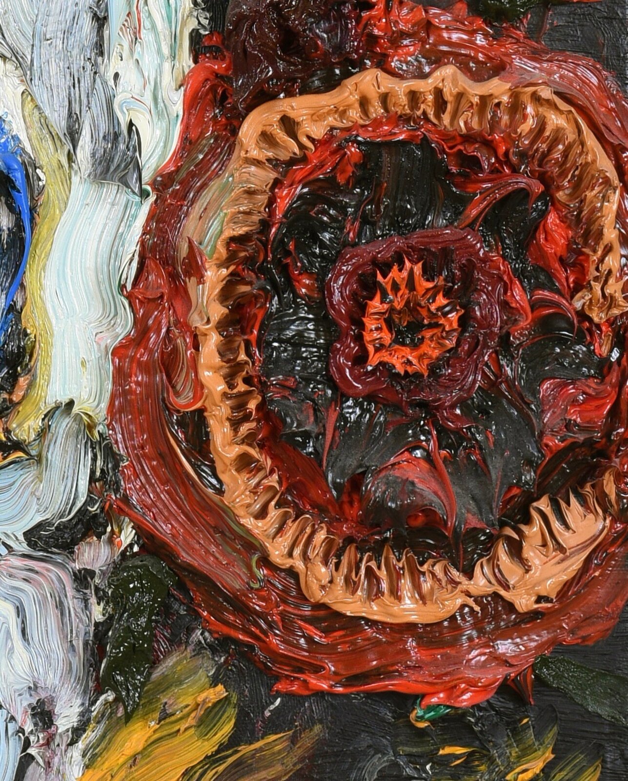 A thick-painted skull surrounded by a vibrant, textured floral crown against a dark background.