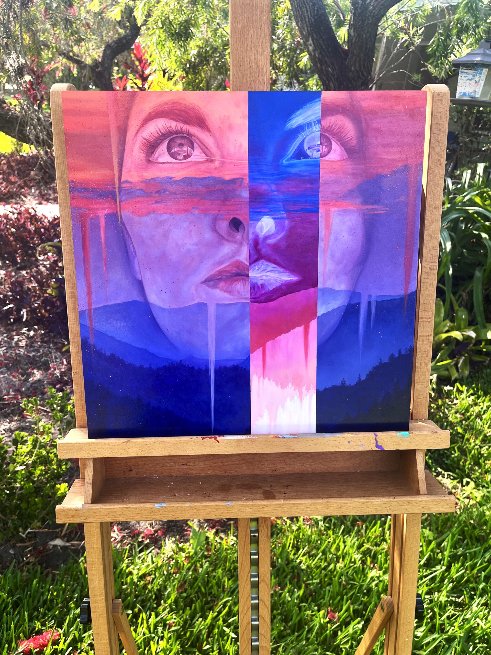 A painting of a woman's face with a mountain in the background.