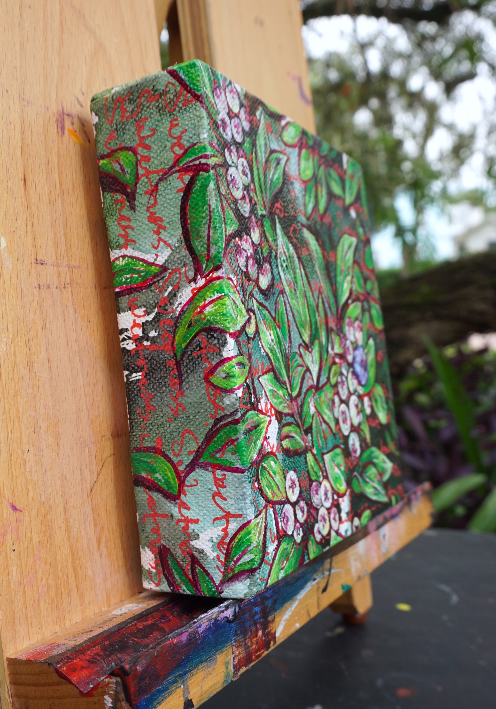 A vibrant botanical painting of berries and leaves with a textured, expressive style.