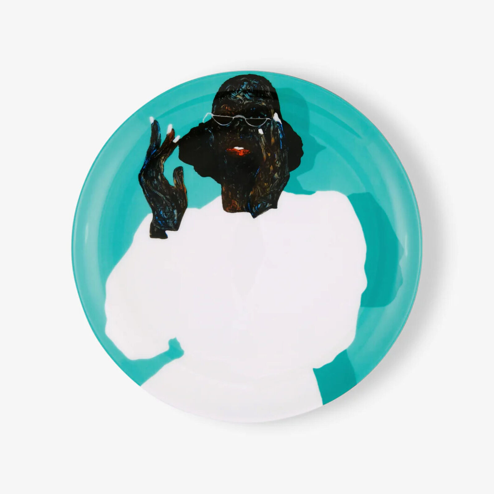 A plate with a picture of a man smoking a cigarette.
