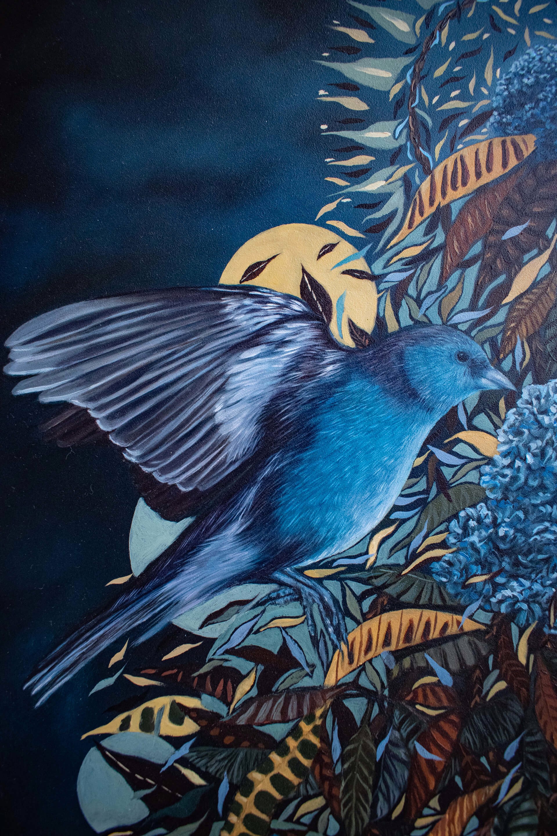 A painting of a hand holding a bunch of flowers and birds.