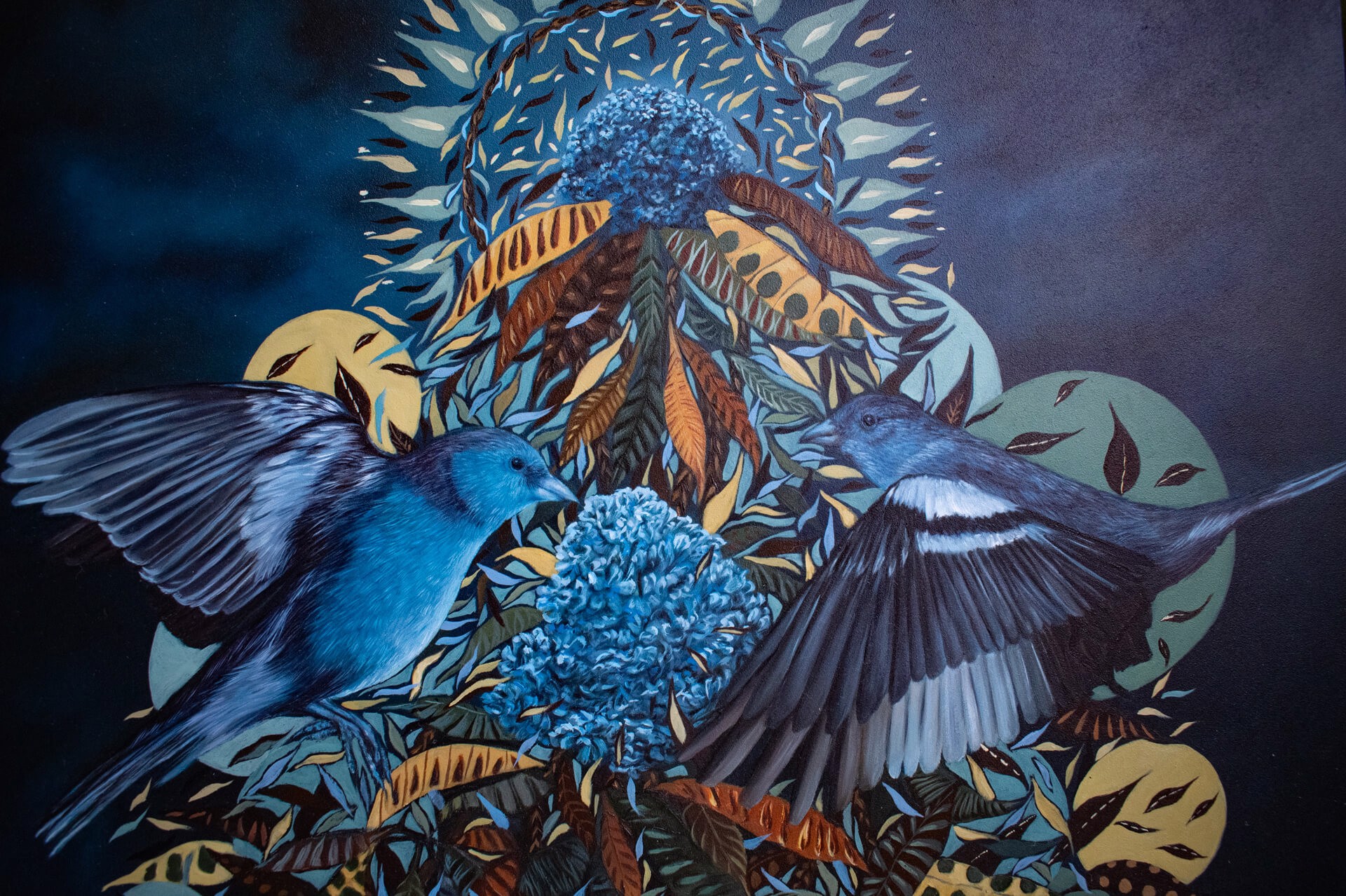 A painting of a hand holding a bunch of flowers and birds.