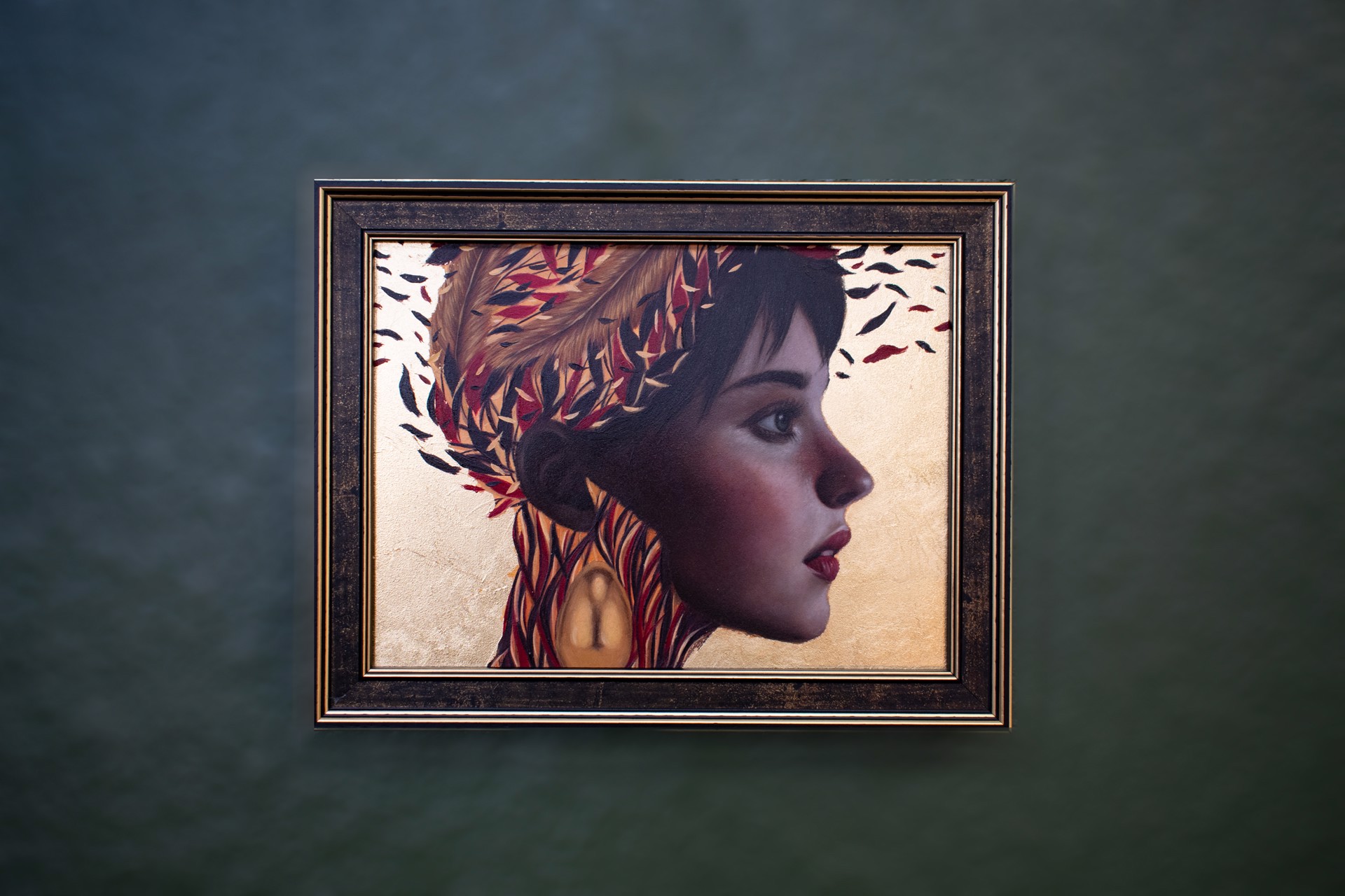 A painting of a woman with feathers on her head.