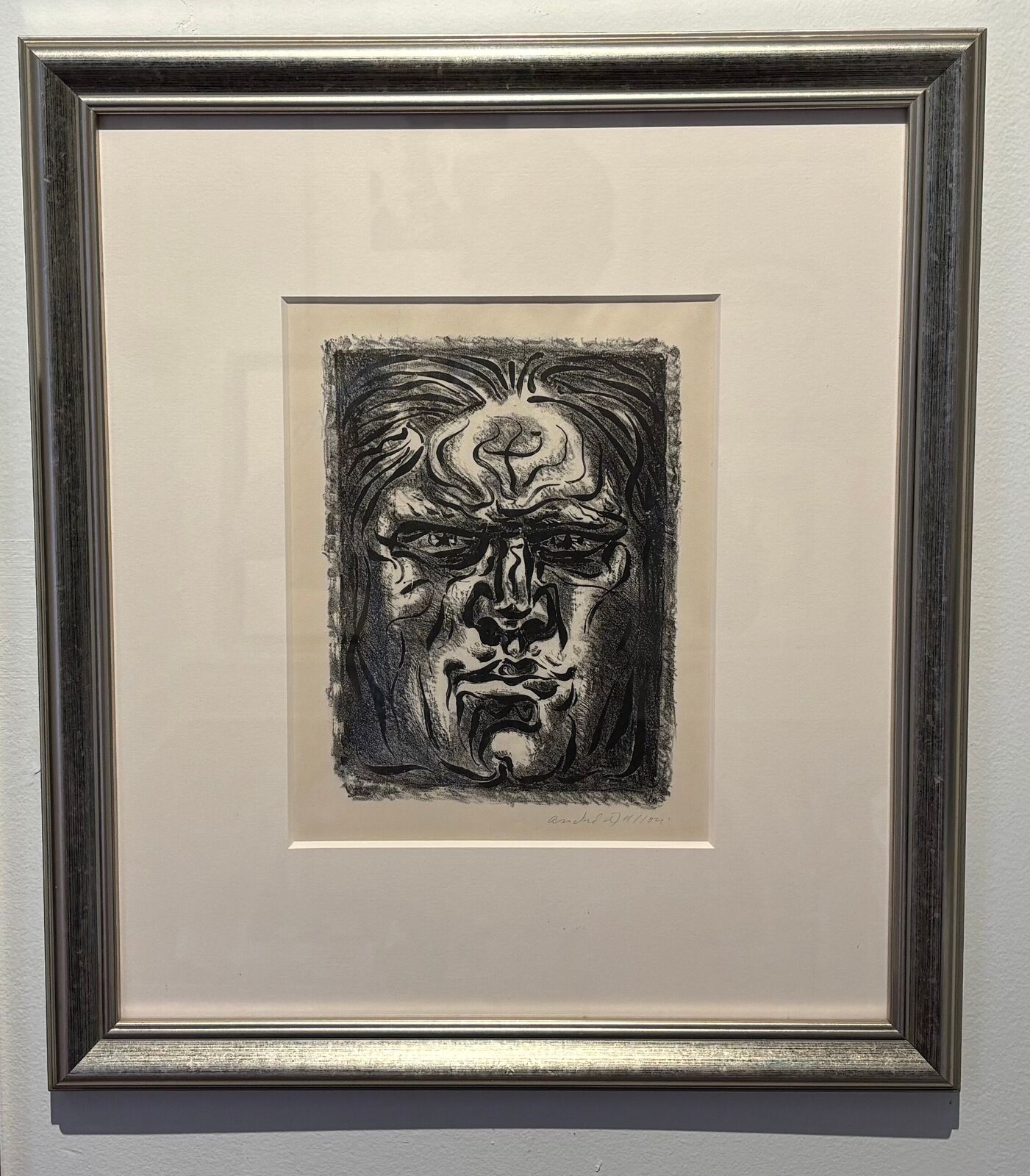 A black and white drawing of a man's face.