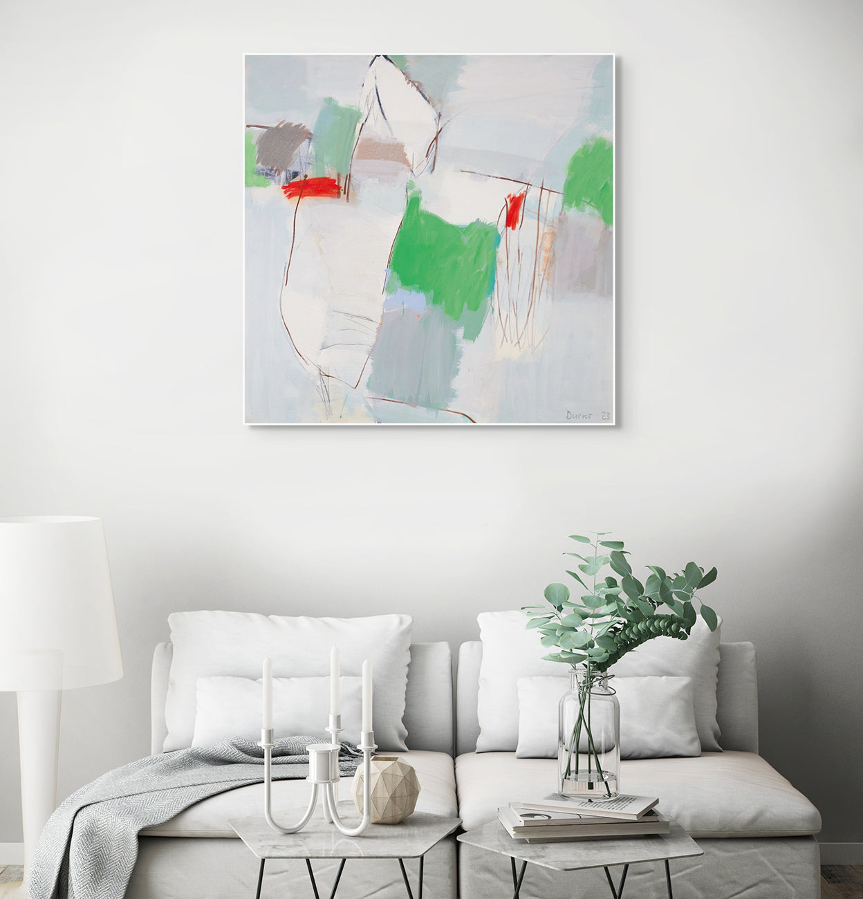 A painting with green, red, and blue paint on a white background.