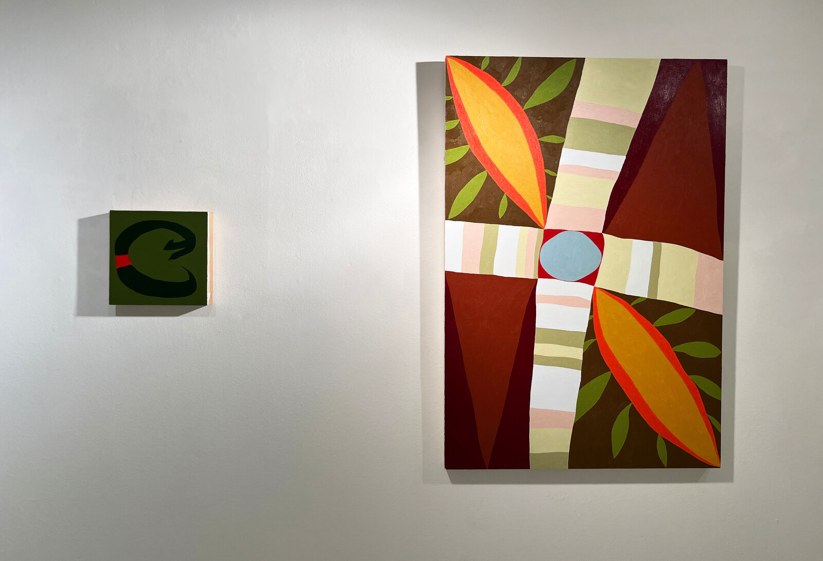 A bold, abstract composition featuring a thick black loop with a red square against an olive green background.
