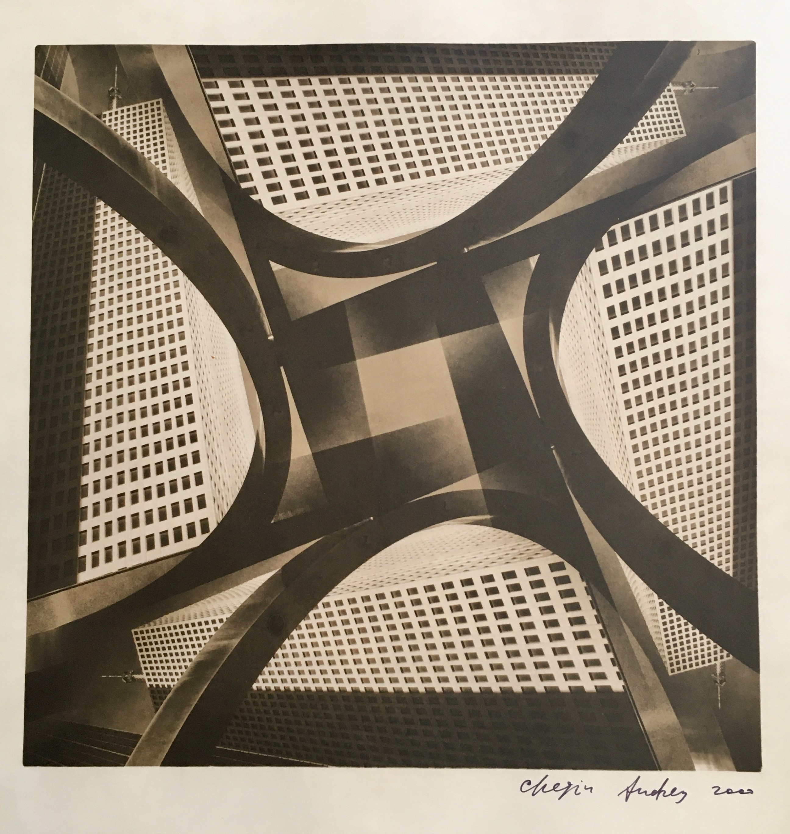 A black and white photo of a building with a geometric pattern.