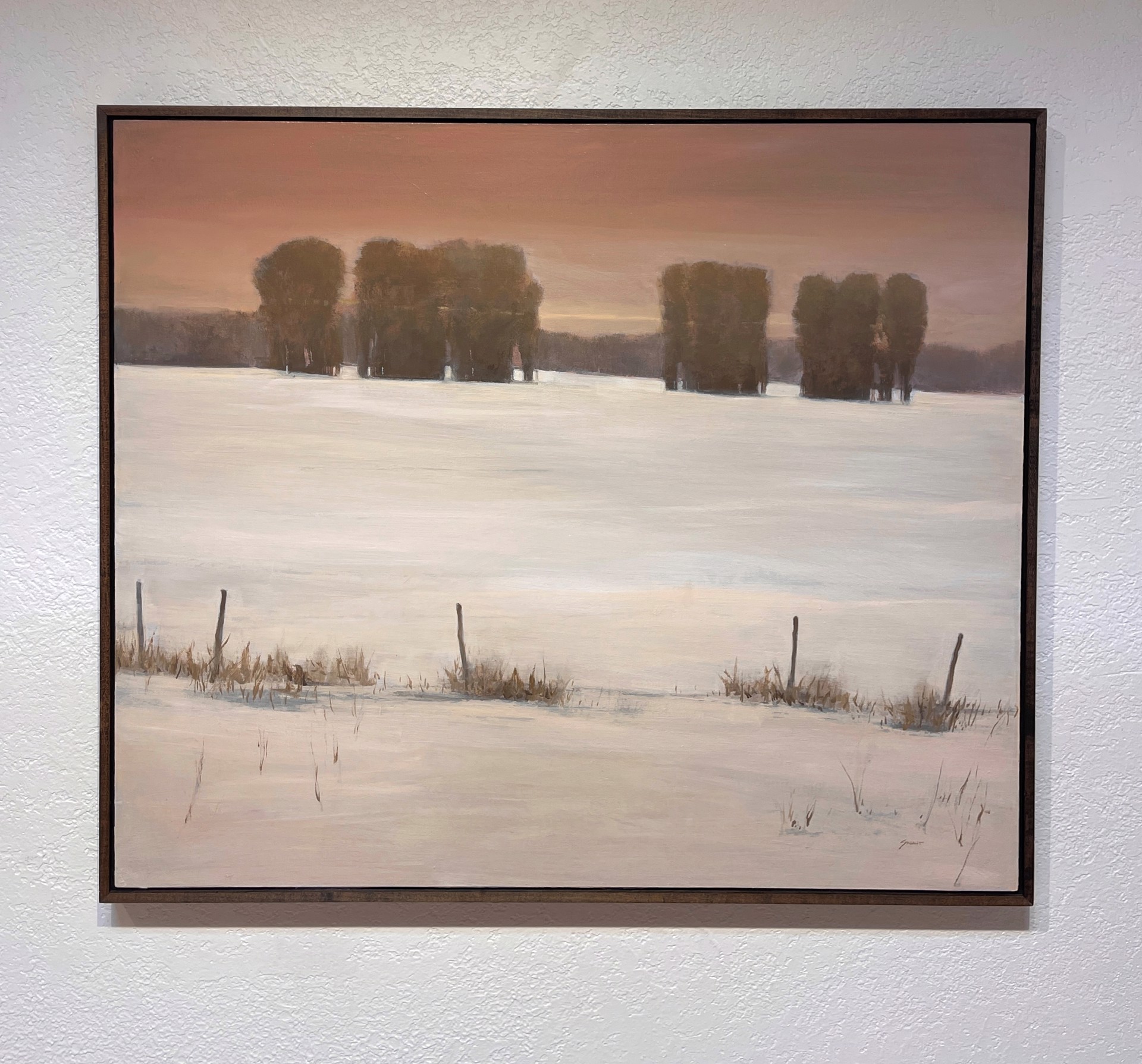 A painting of a snow covered field with trees in the distance.