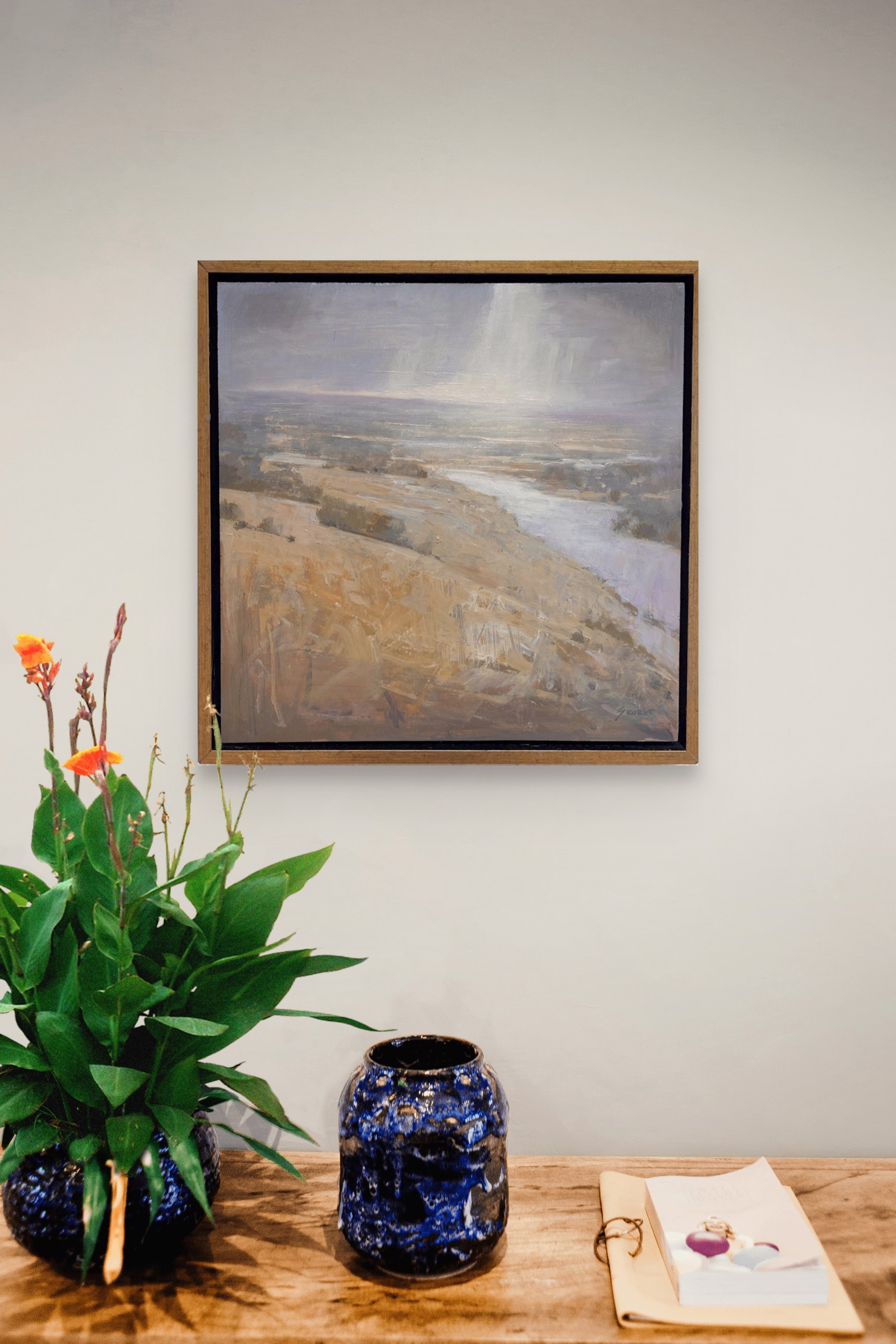 A painting of a landscape with a river running through it.