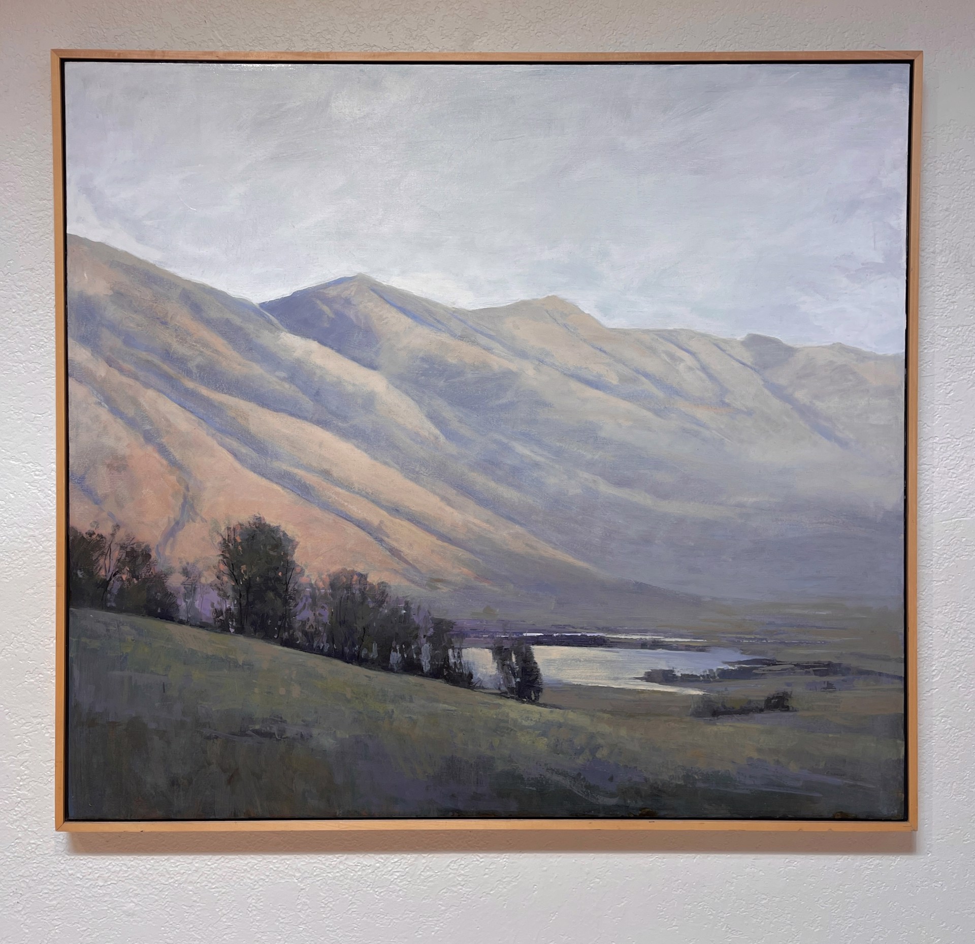 A painting of a landscape with mountains in the background.
