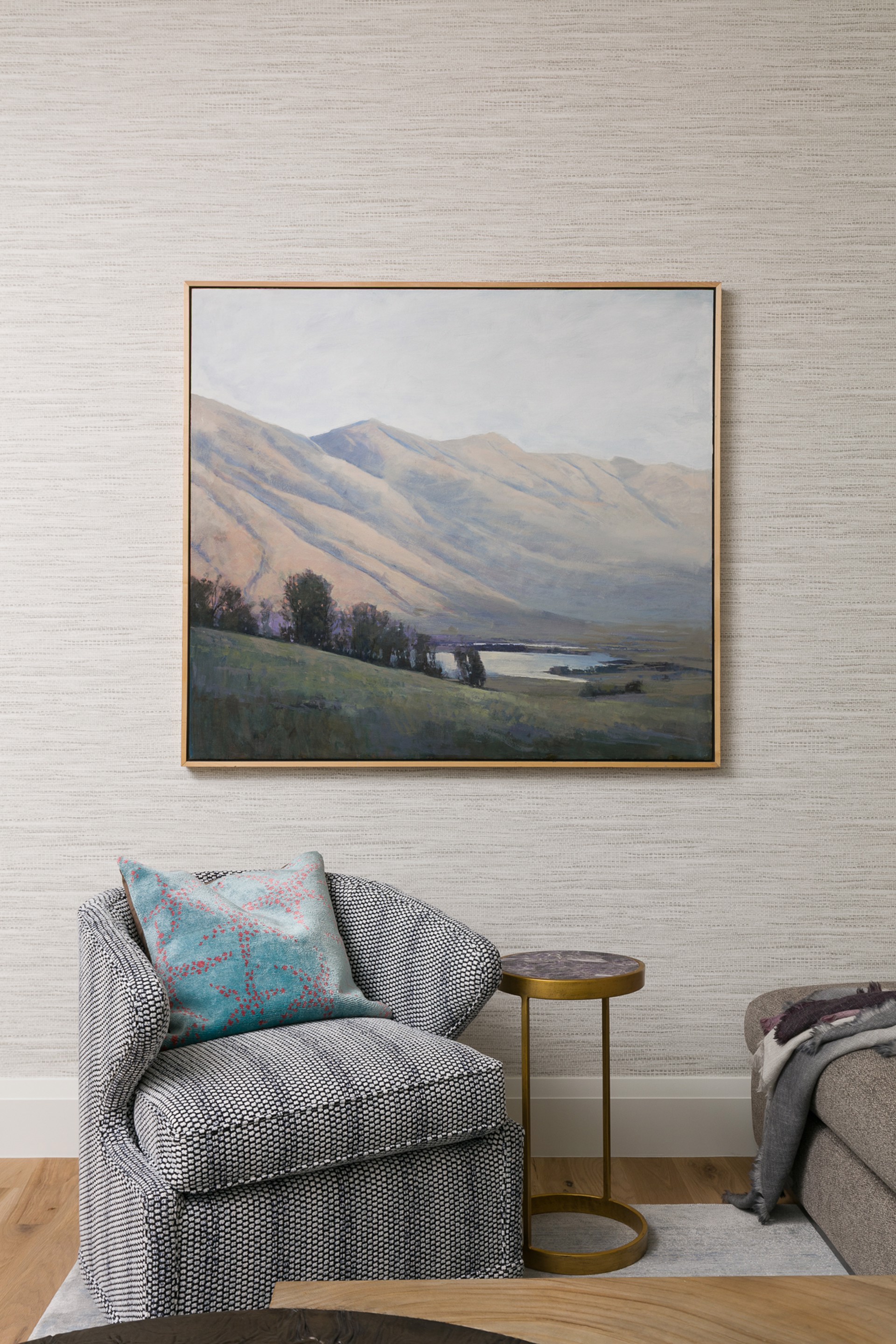 A painting of a landscape with mountains in the background.