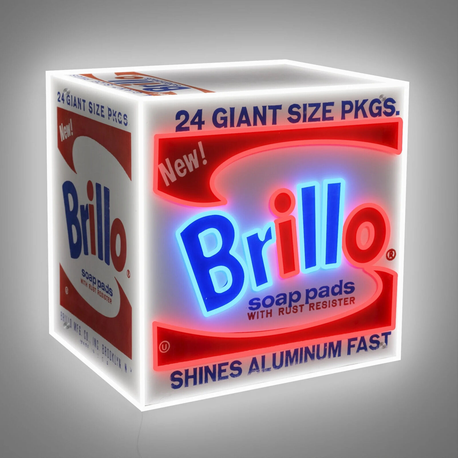 A box of brillo soap pads with a neon sign on it.