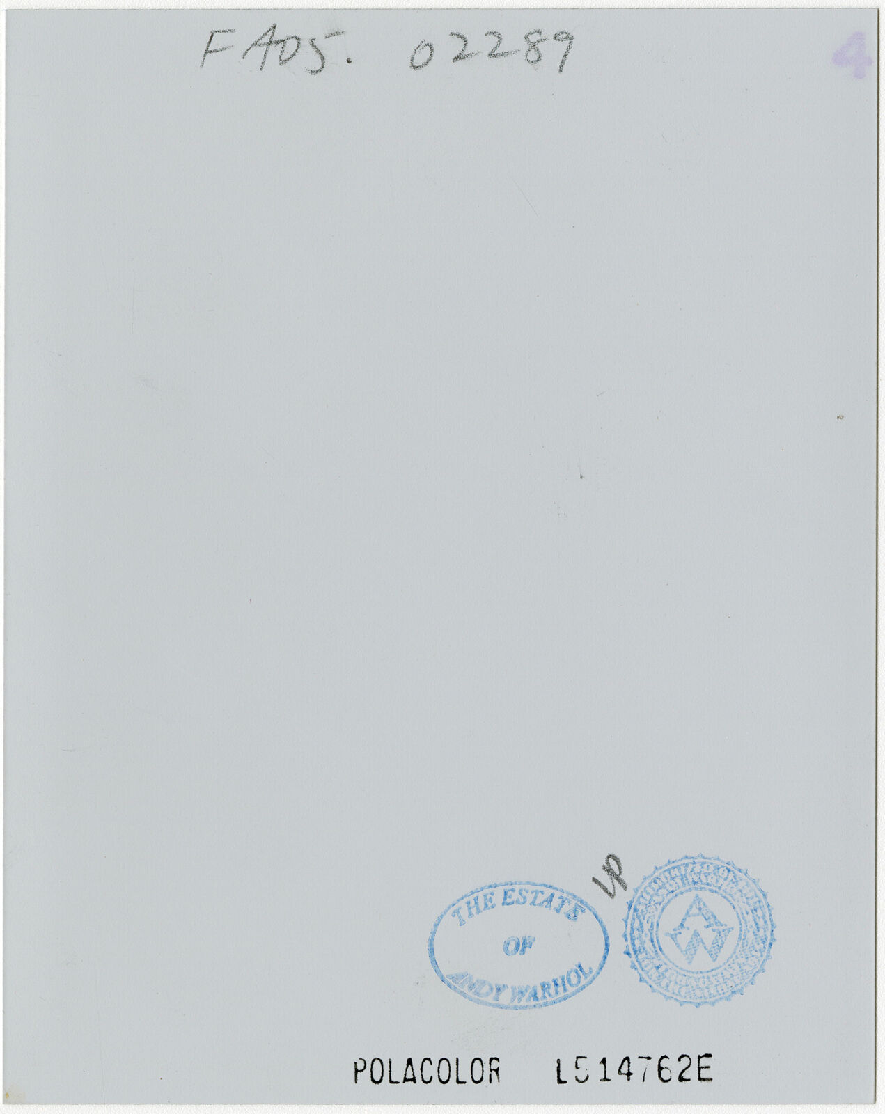 A man in a suit and tie smiles at the camera.