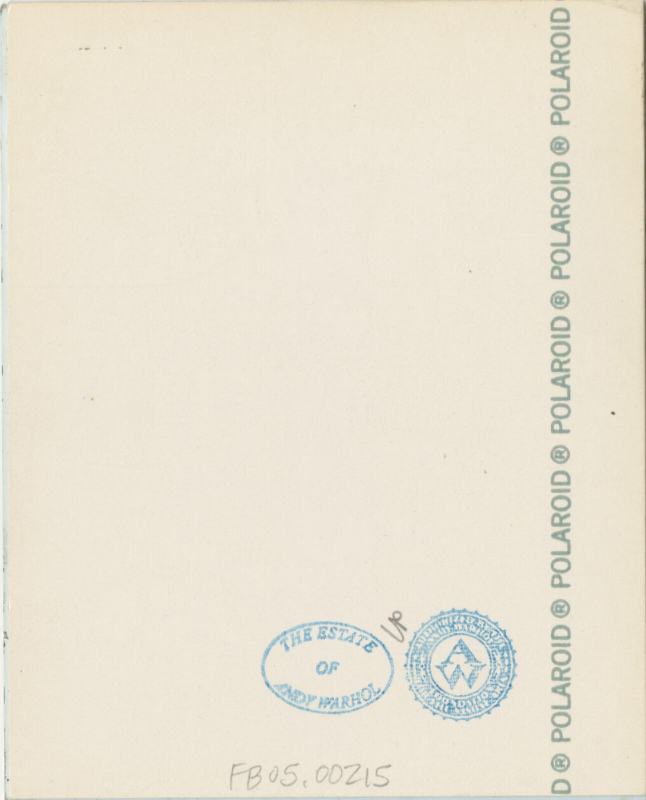 A man in a plaid shirt smiles at the camera. 