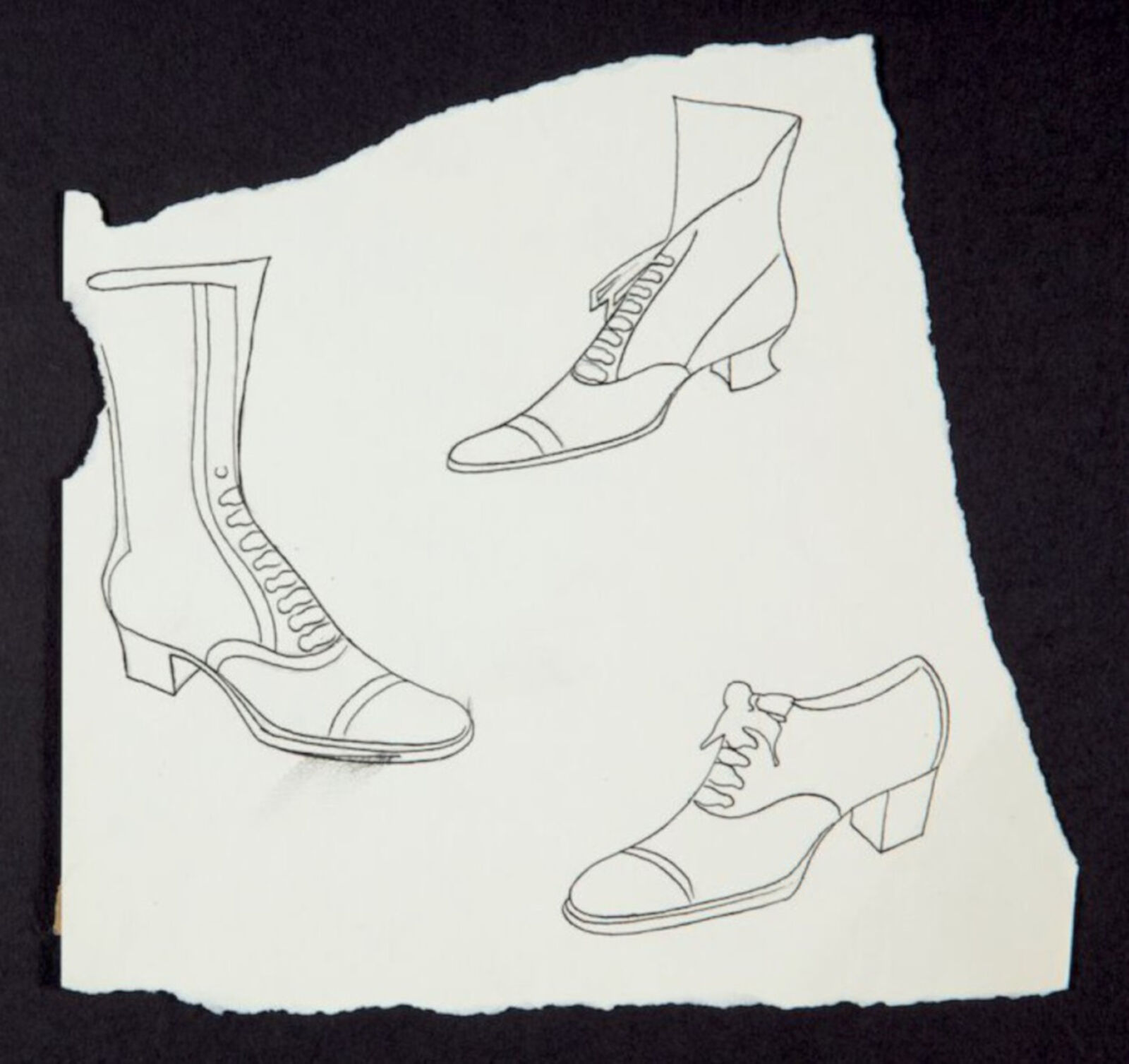 A drawing of three pairs of shoes on a piece of paper.
