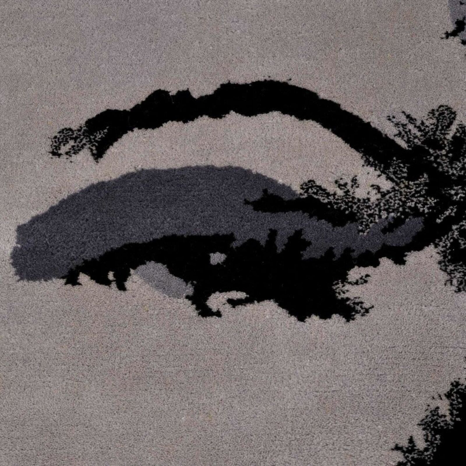 A black and white image of a woman's face.