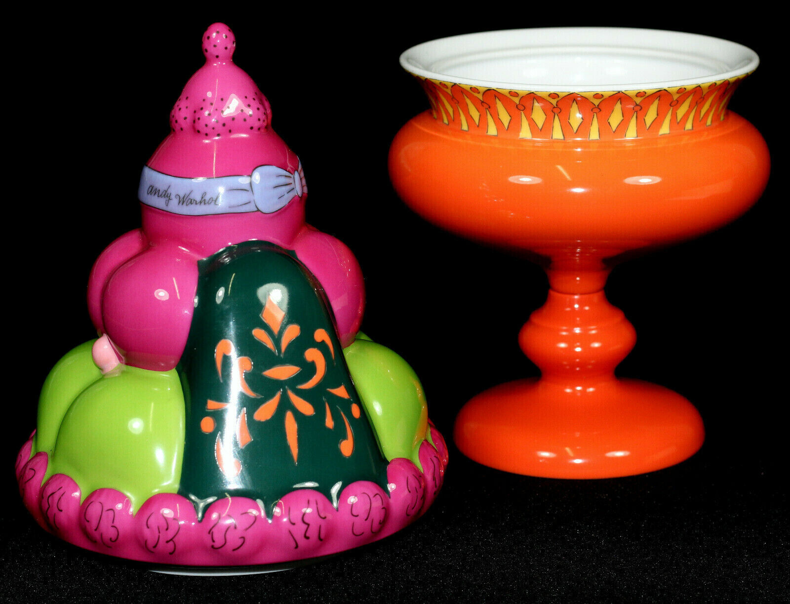 An orange vase with a pink hat on top of it.