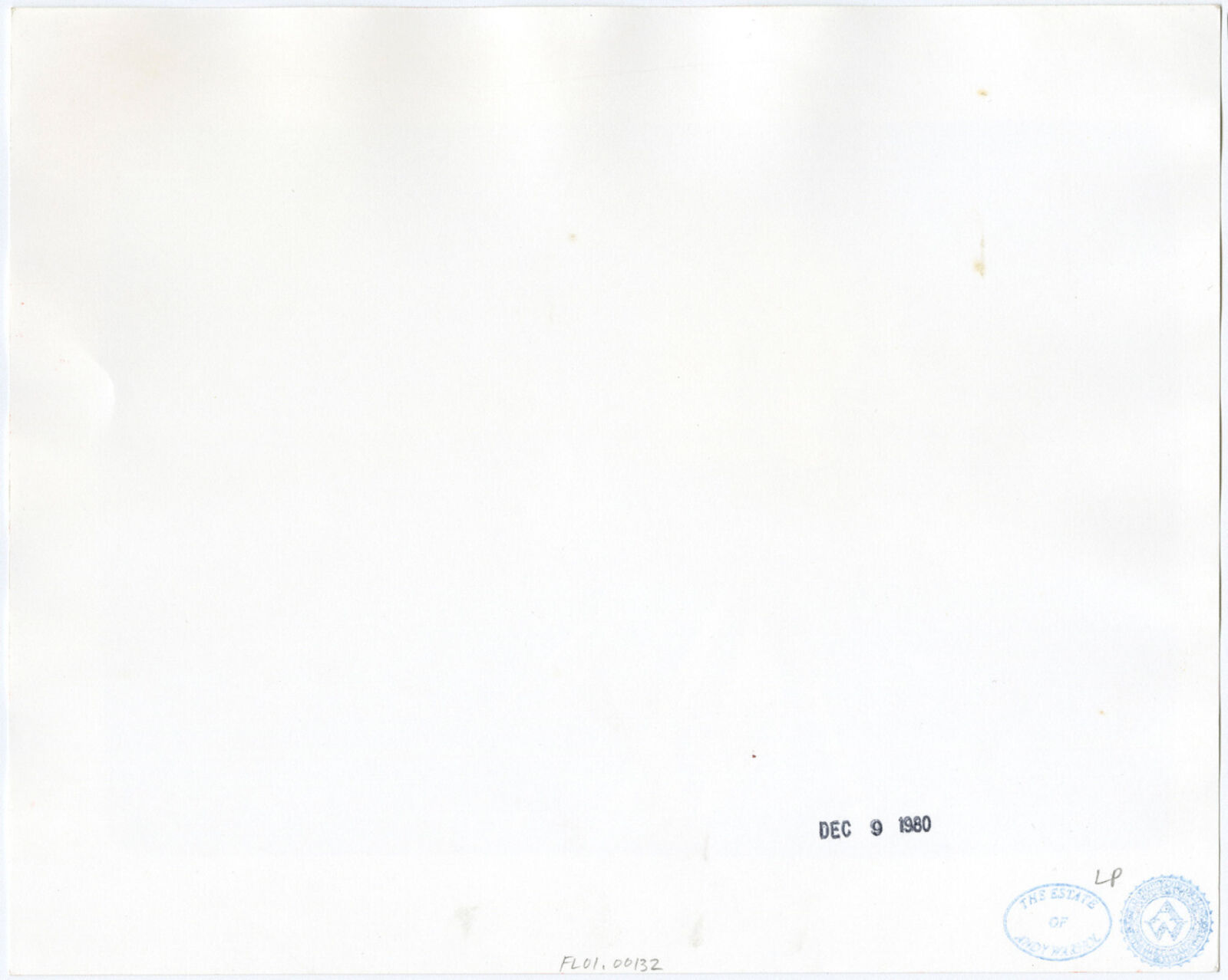 A black and white photo of a man getting his hair cut.