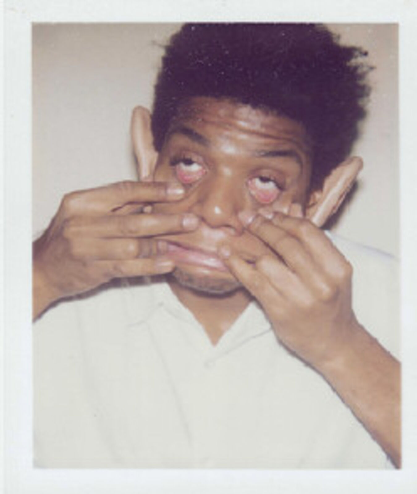 A man covering his face with his hands. 