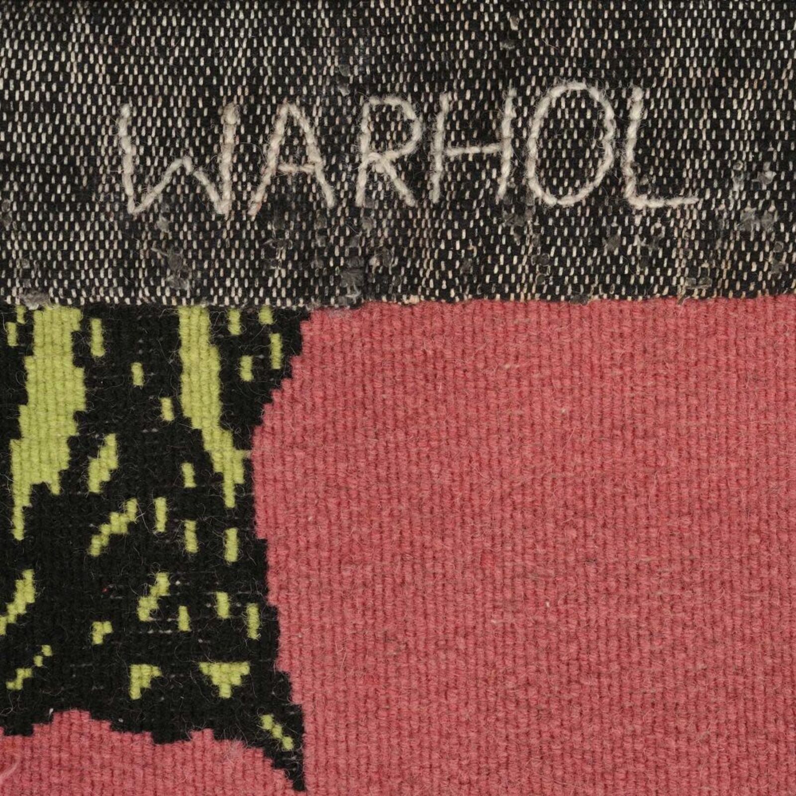 A painting of three red and orange flowers on a green background.