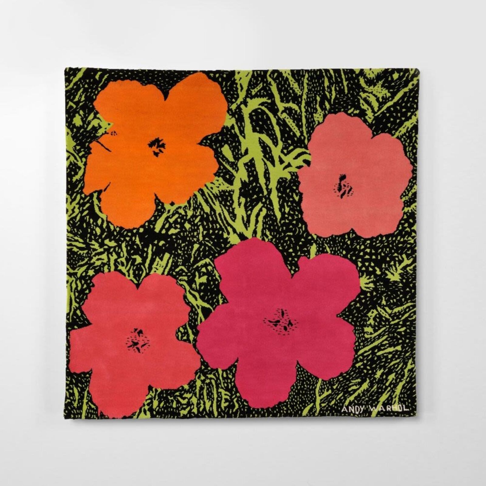 A painting of three red and orange flowers on a green background.