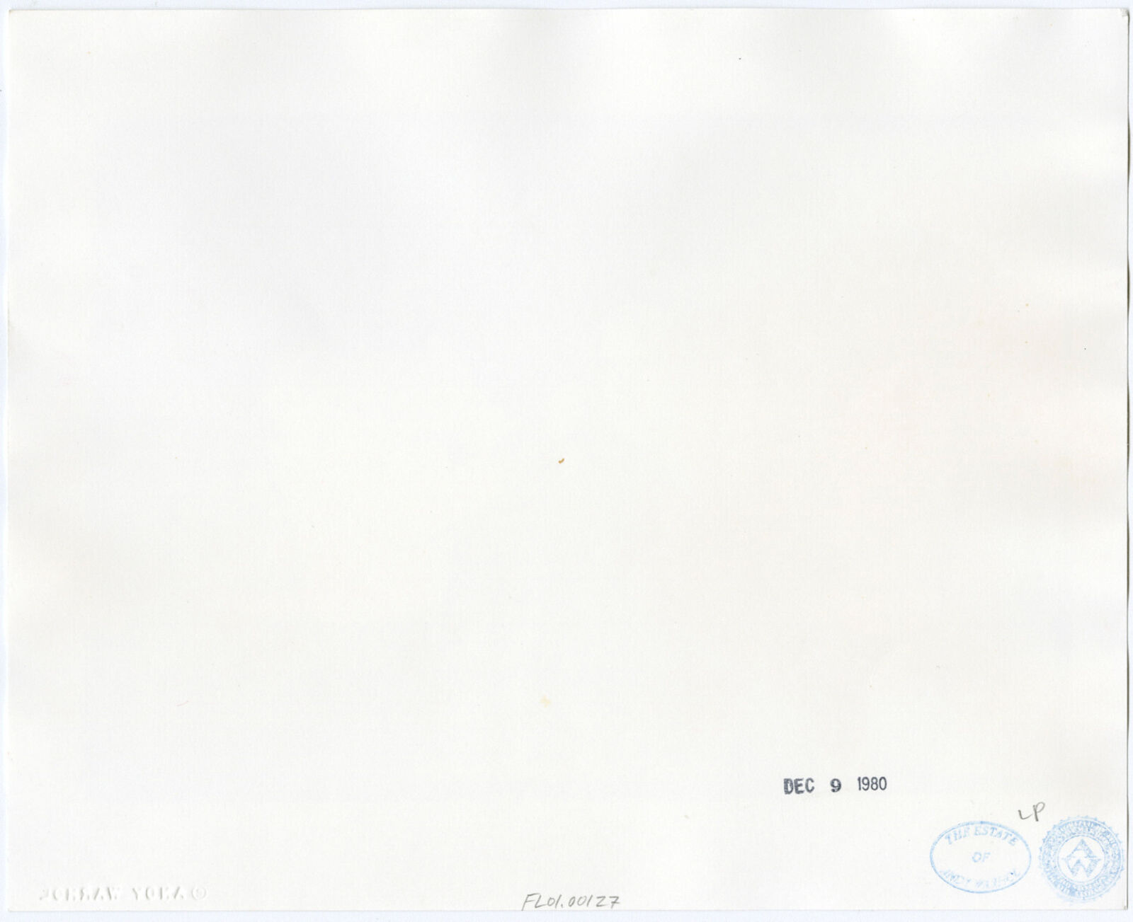 A black and white photo of a man getting his hair cut.