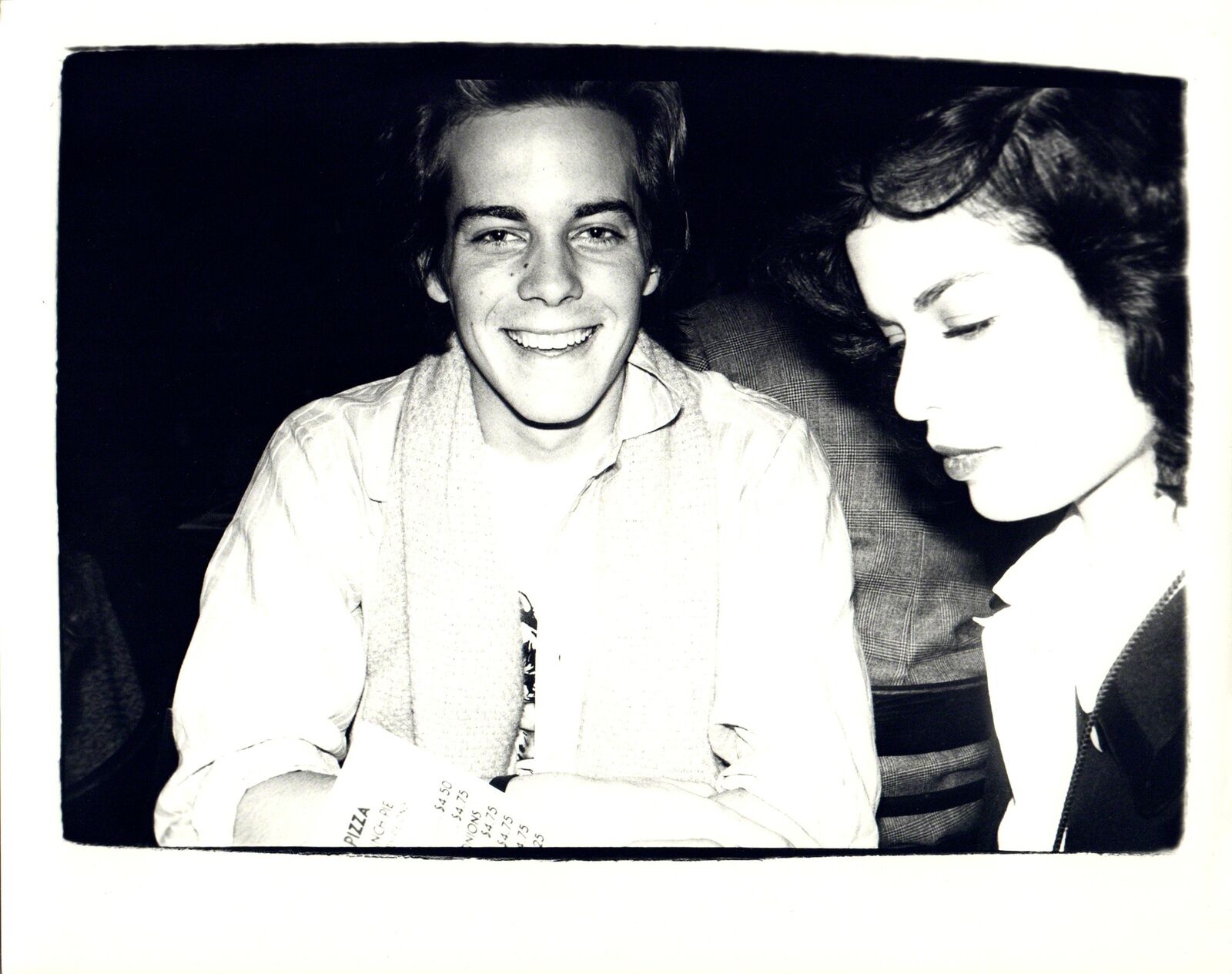 A black and white photo of a man and a woman.