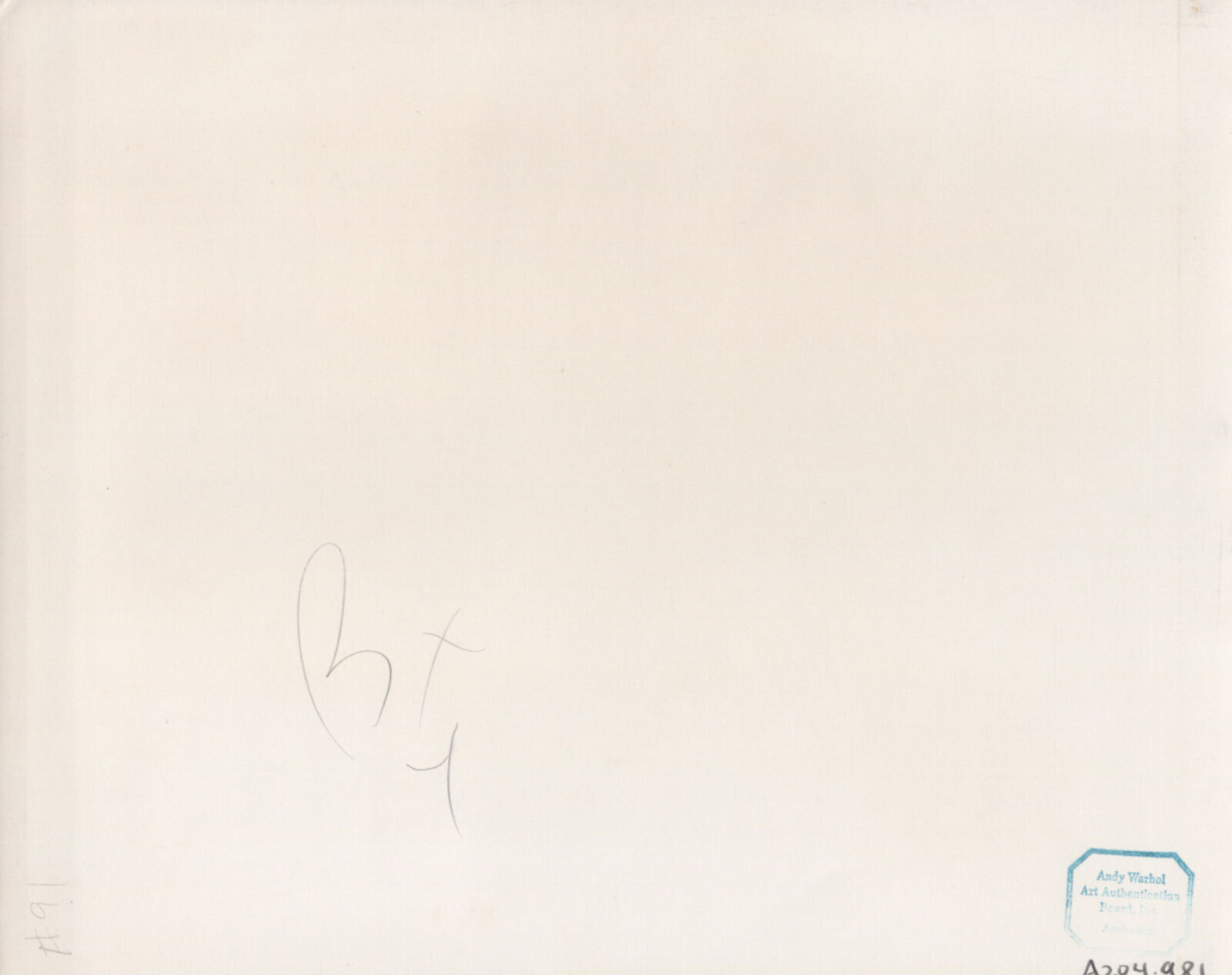 A black and white photo of a man holding a remote control next to another man.