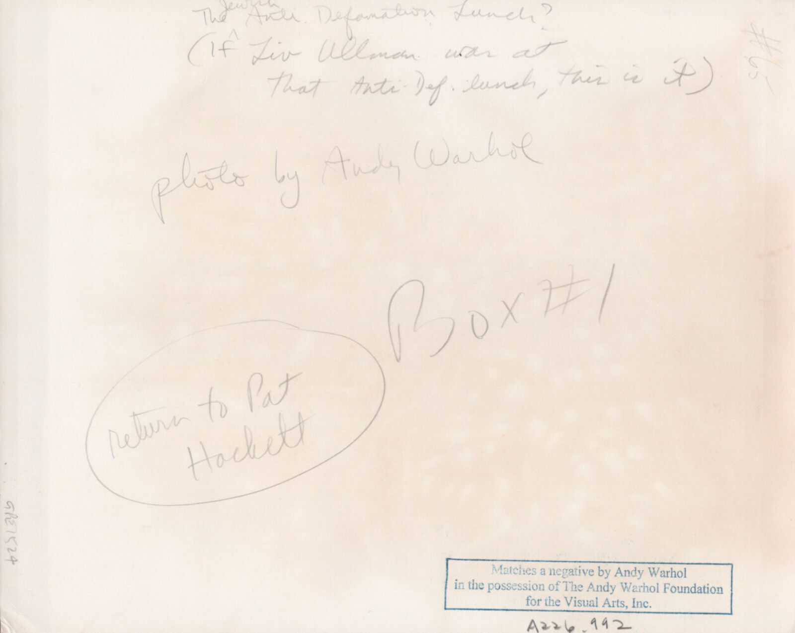 A group of people sitting around a long table.