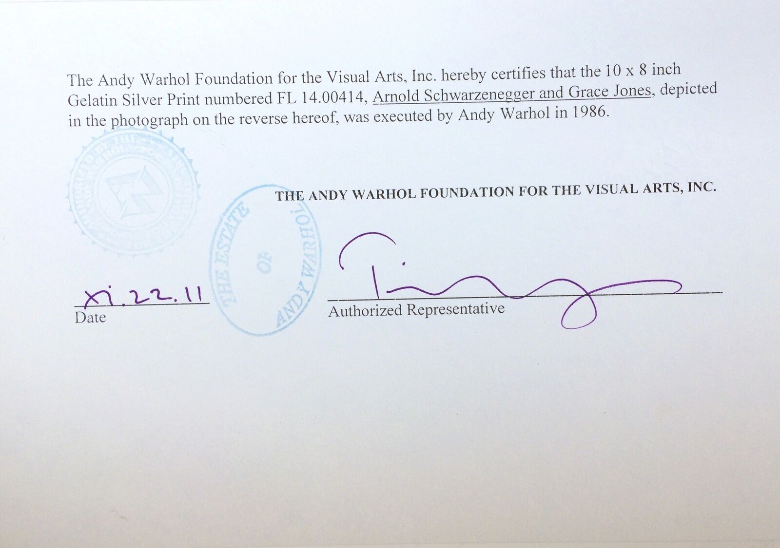 A man and a woman kissing in a tent.