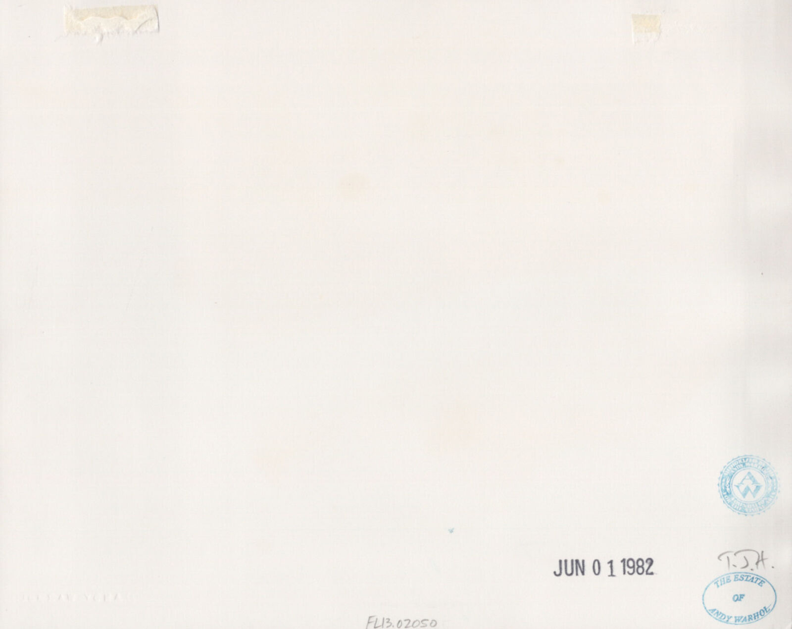 A black and white photo of a building with columns.