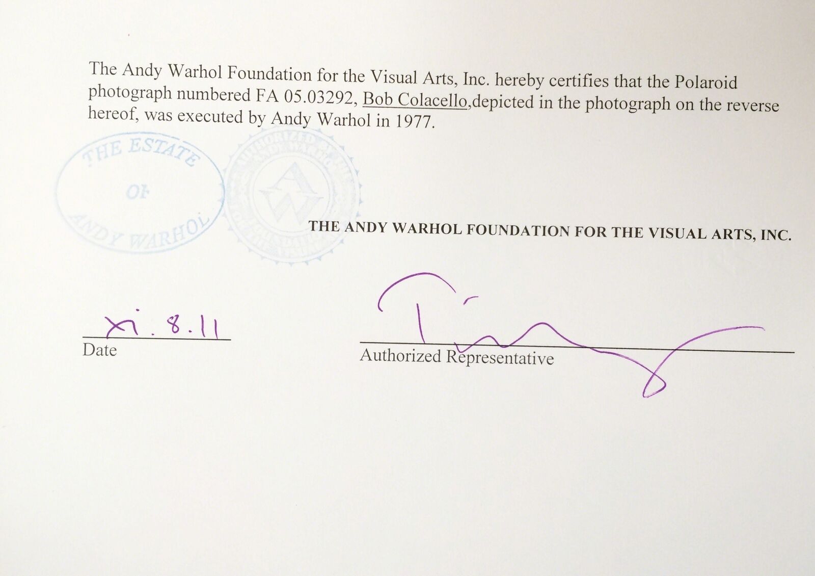 A man in a striped shirt and tie with his hand on his chin.