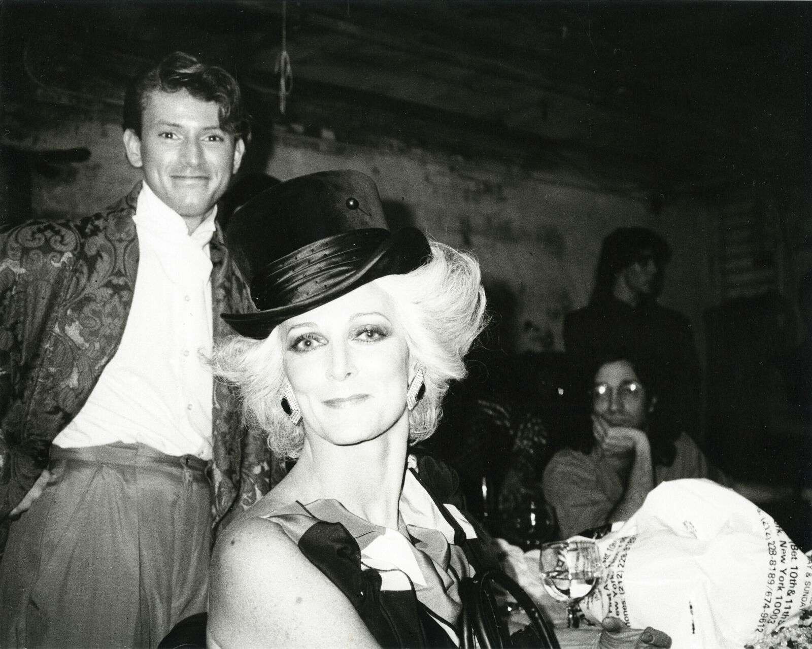 A man and a woman sitting next to each other at a party.
