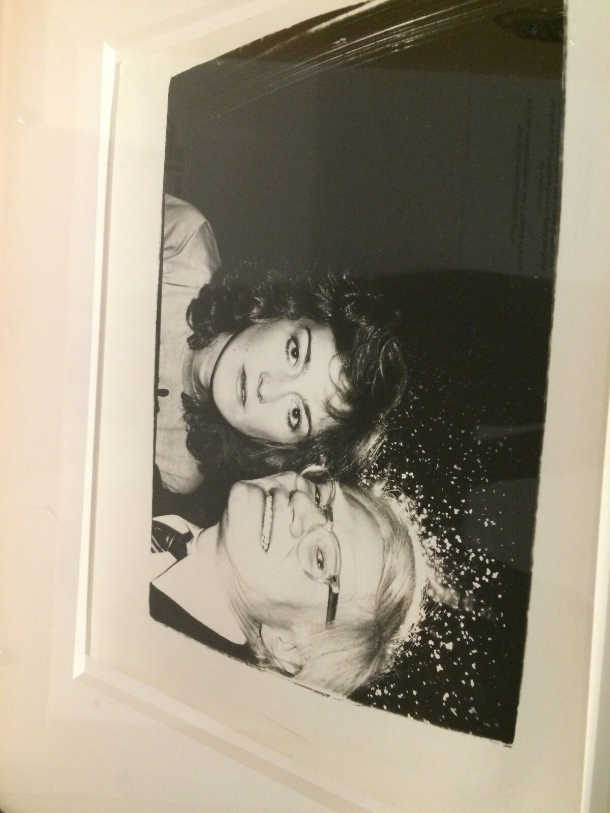 A black and white photo of two women in a frame.