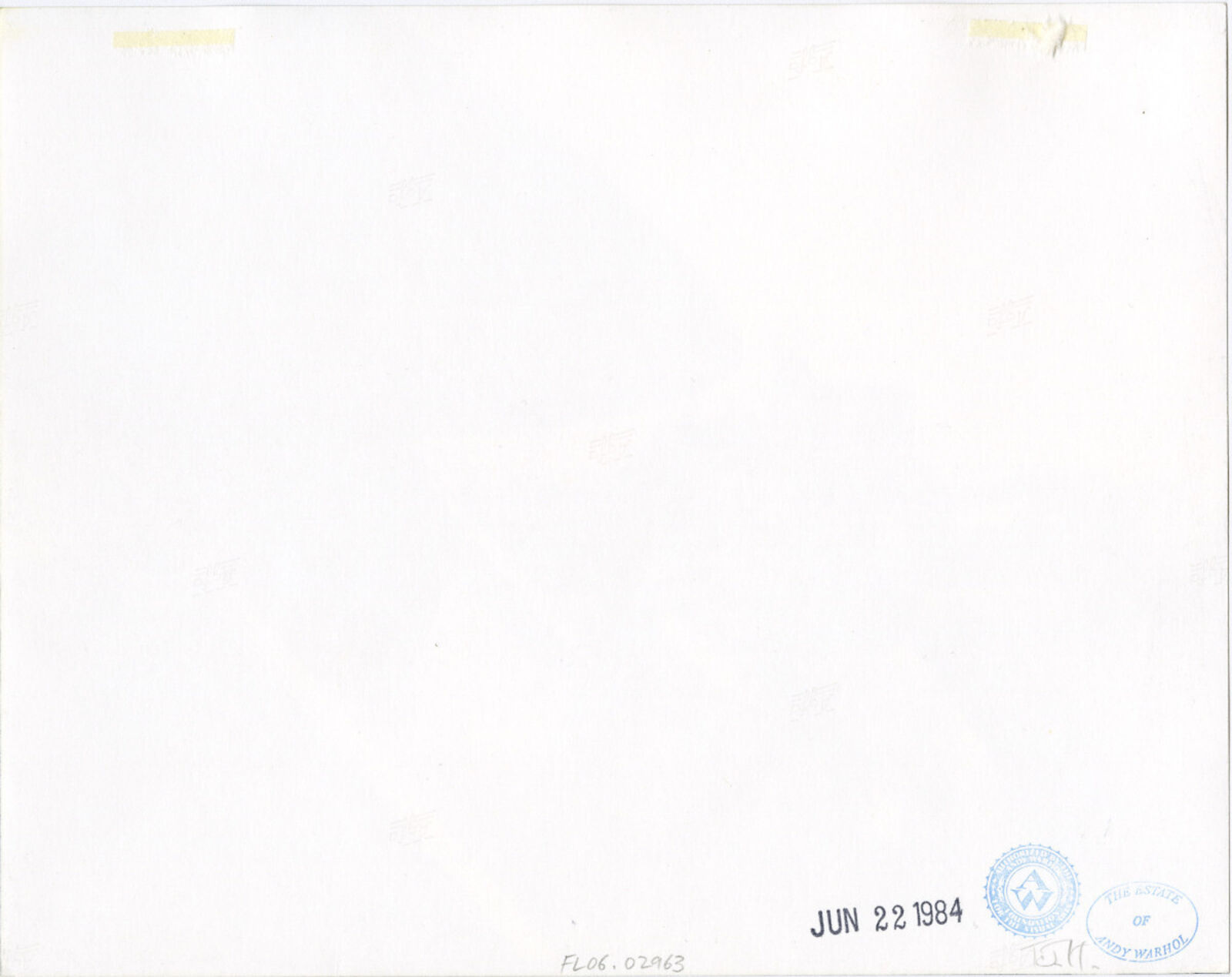 Two men sitting on the back of a boat on the water.