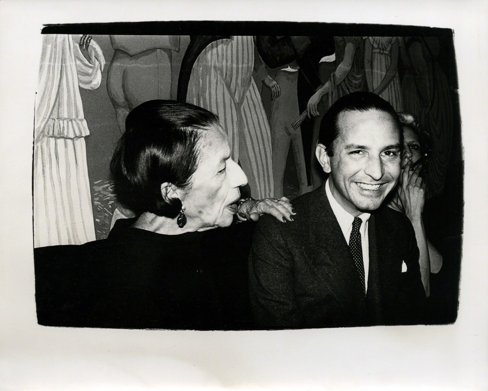 A black and white photo of a man and a woman.