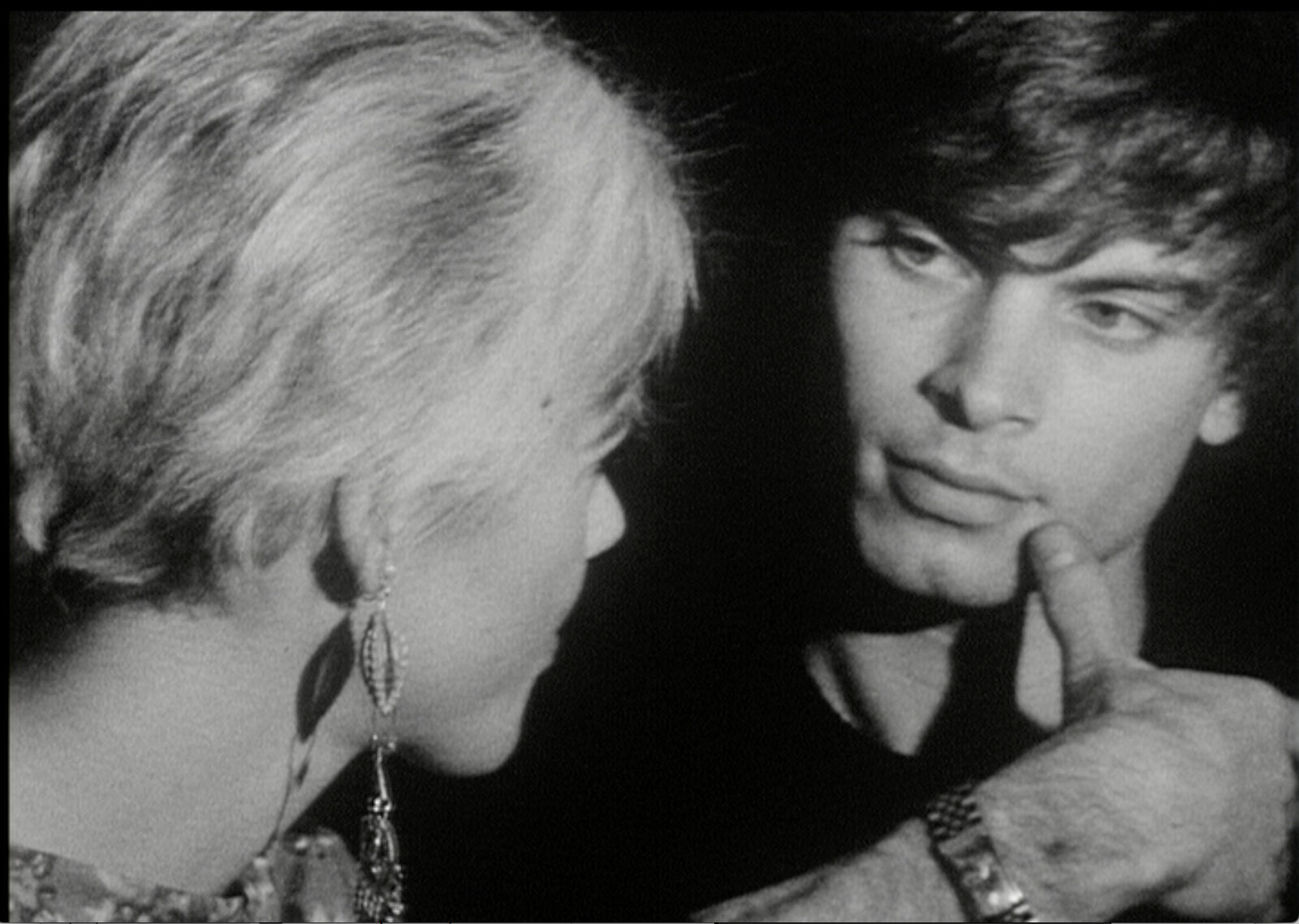 A black and white photo of a man and a woman.