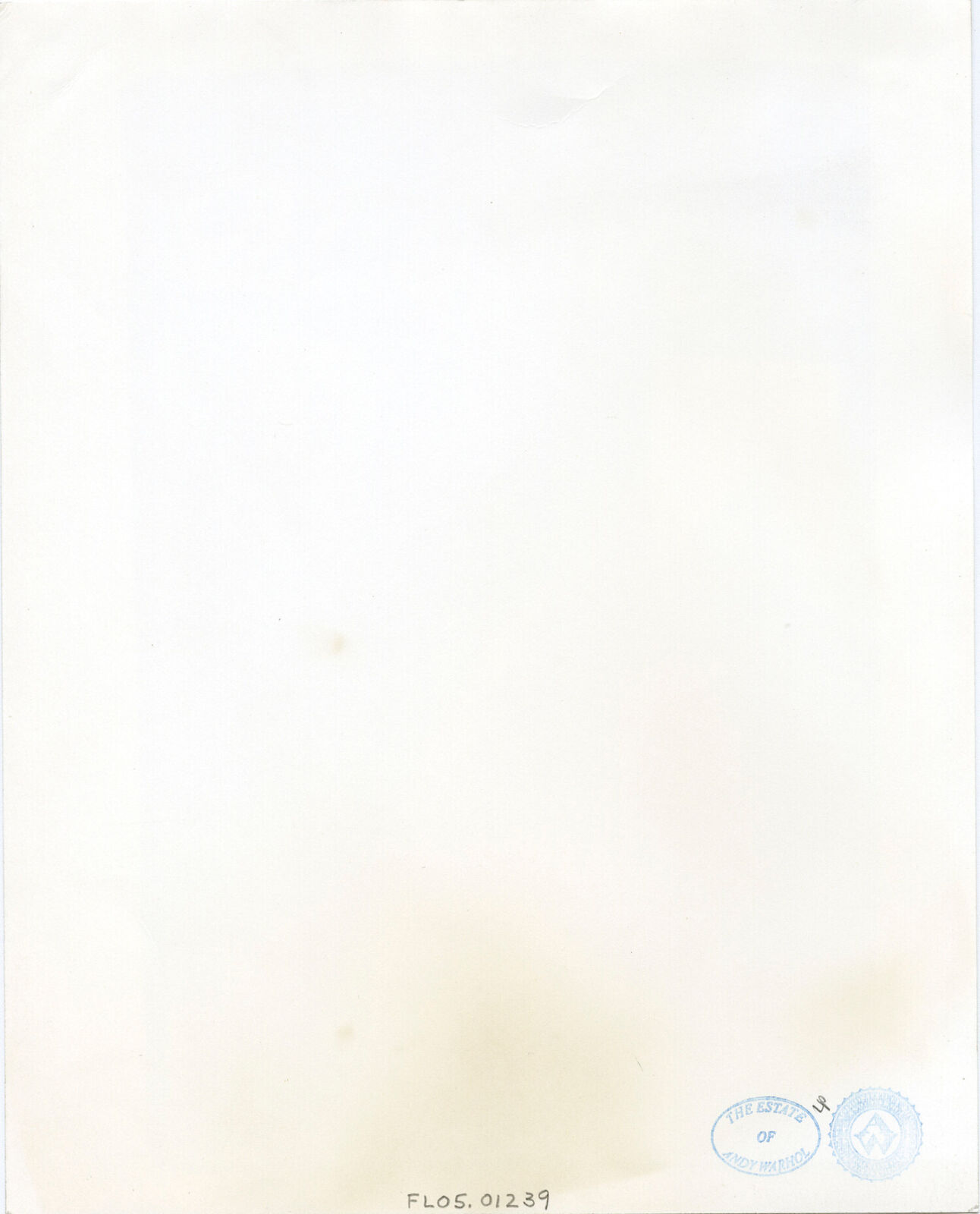 A black and white photo of a man in a suit and sunglasses.