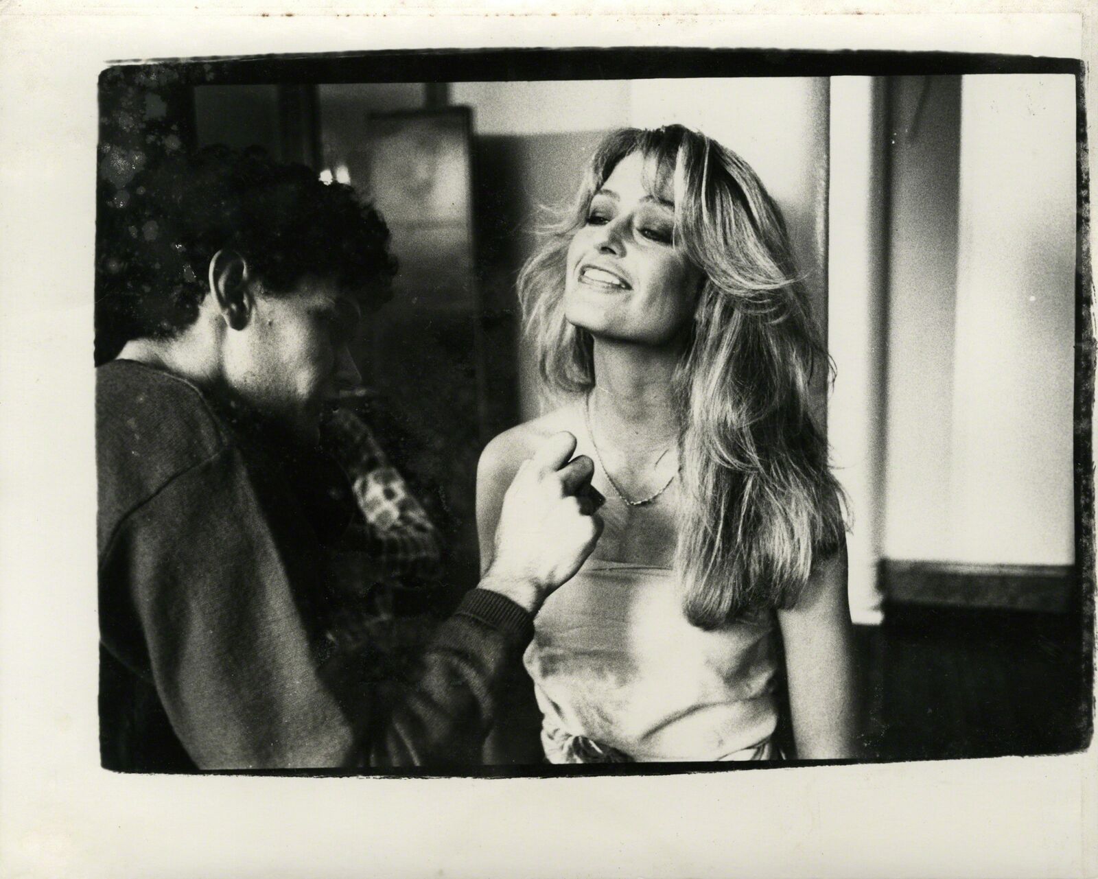 A black and white photo of a man and a woman.