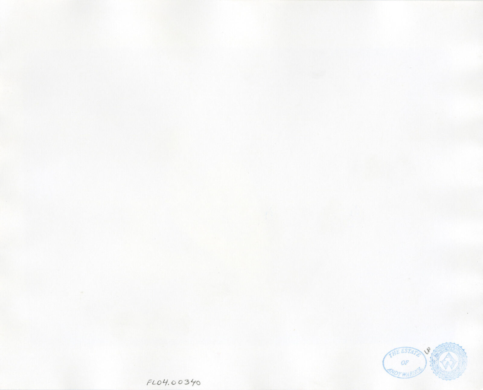 A black and white photo of a woman sitting at a table.