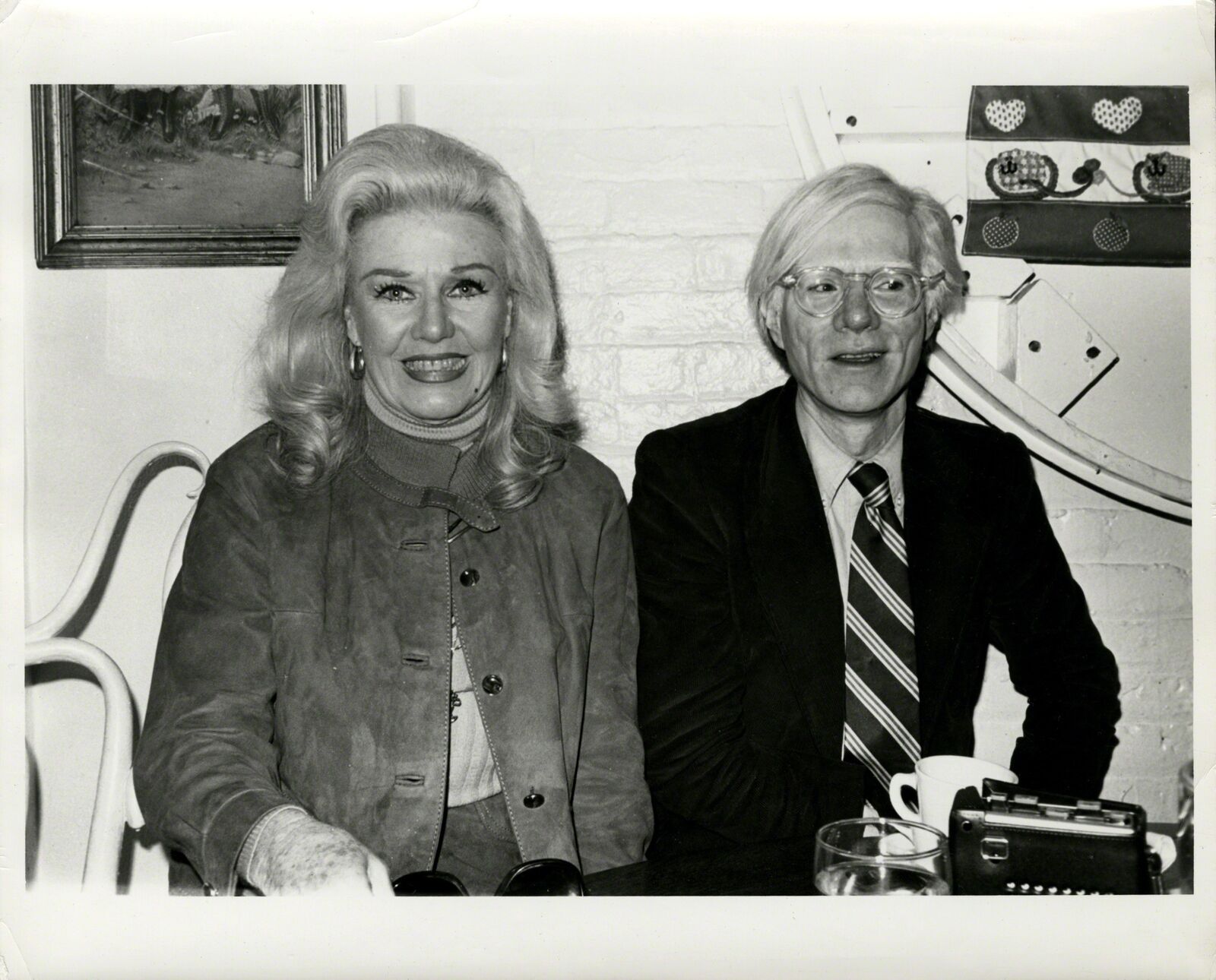 A man and a woman sitting next to each other.