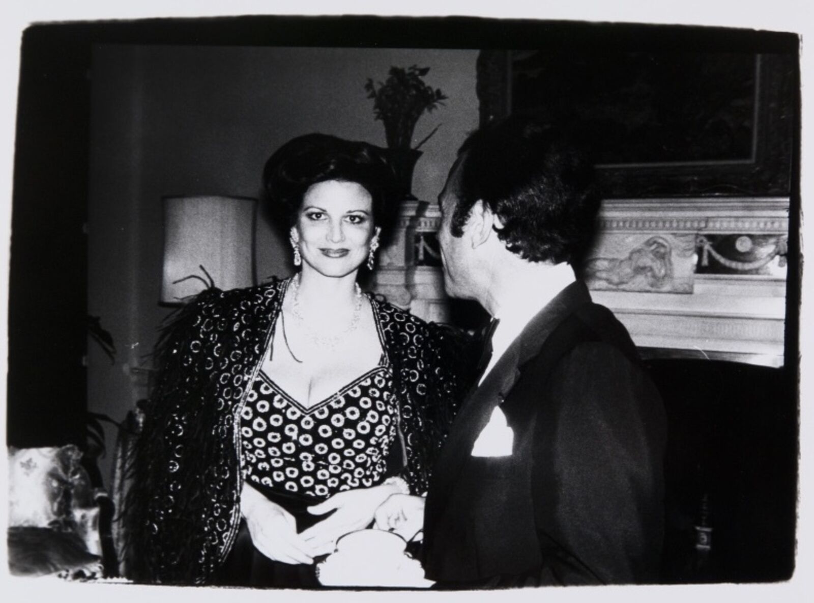 A black and white photo of a man and a woman.