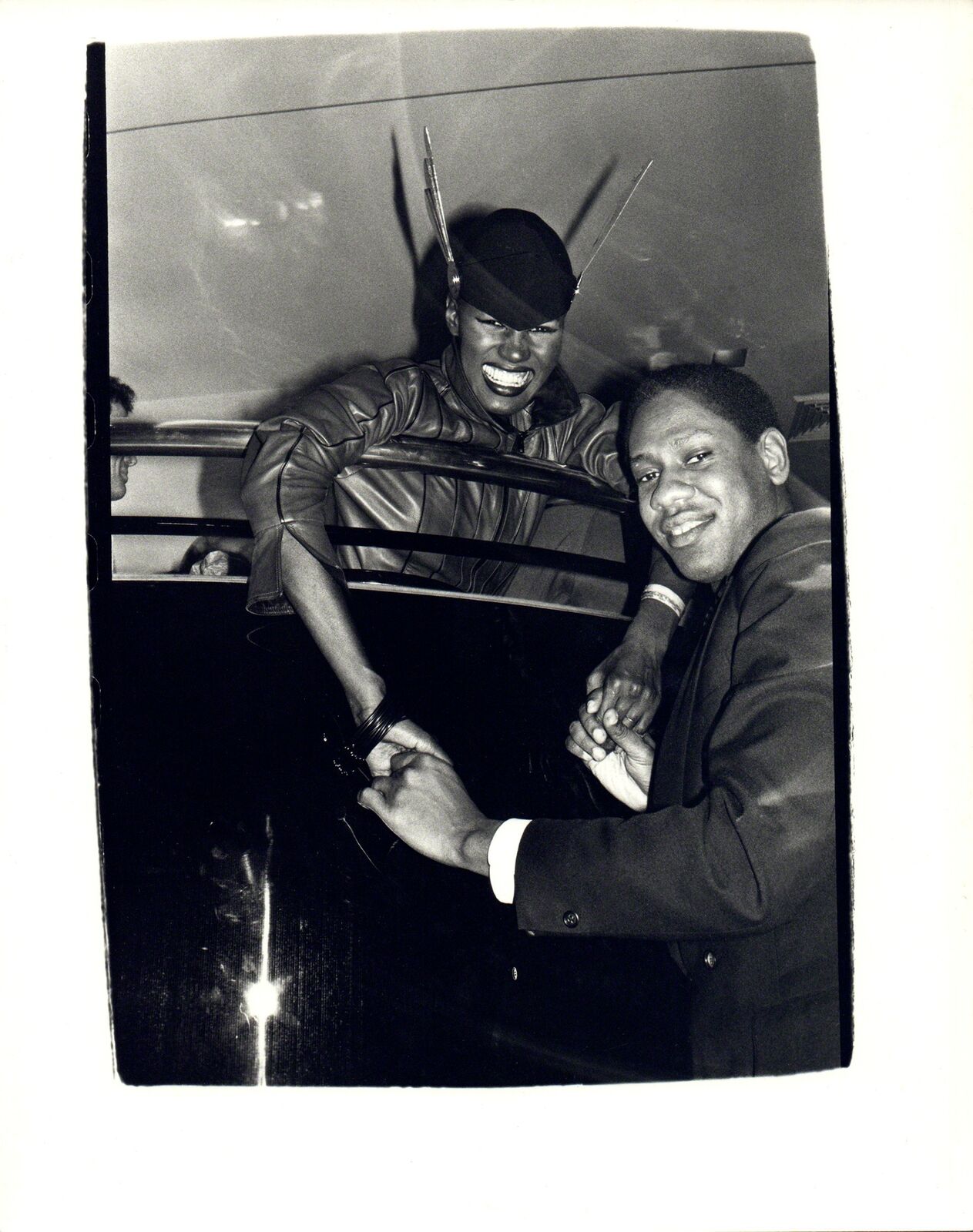 A black and white photo of two men shaking hands.