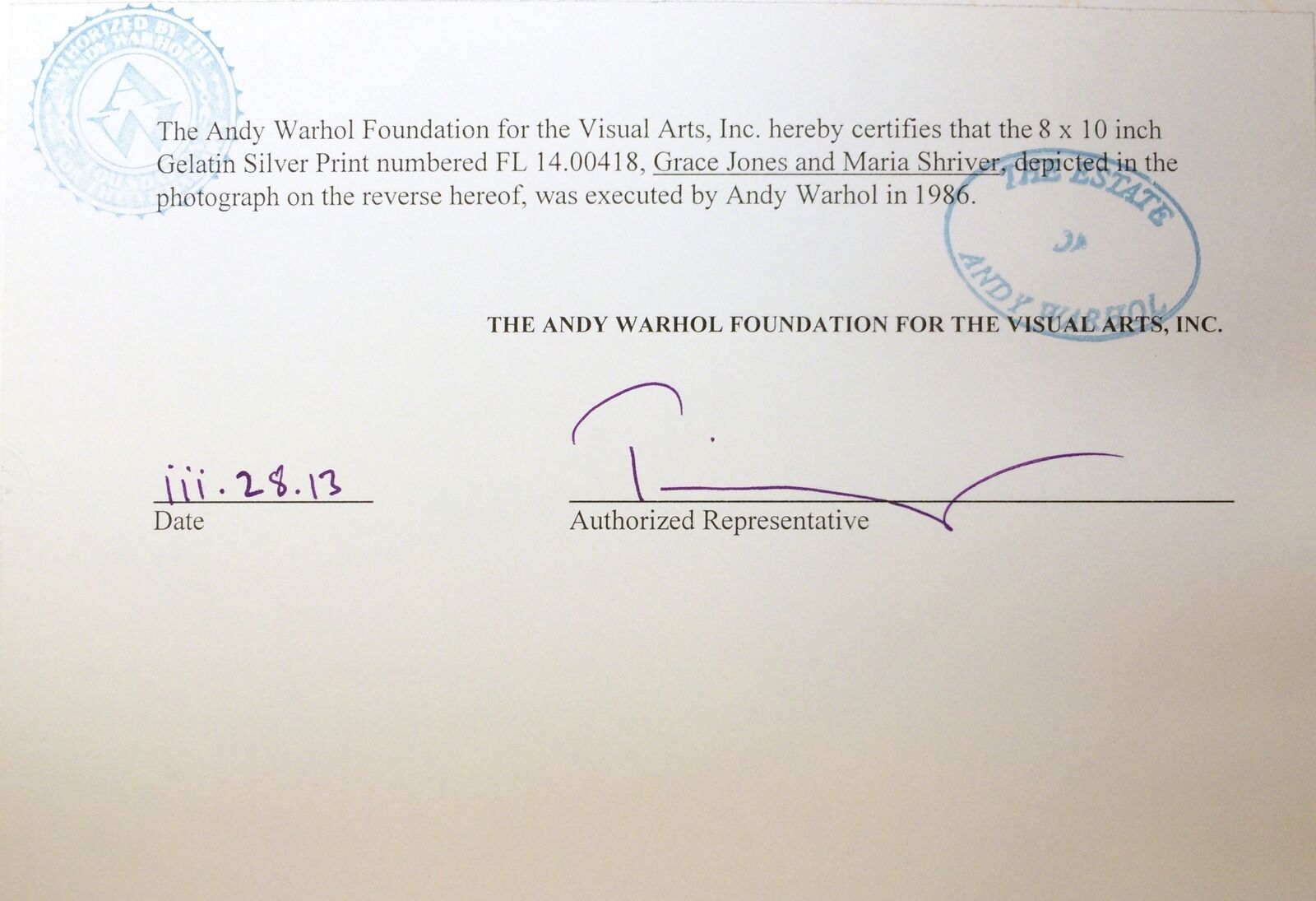 A black and white photo of a woman in a fur hat and a man in a suit.