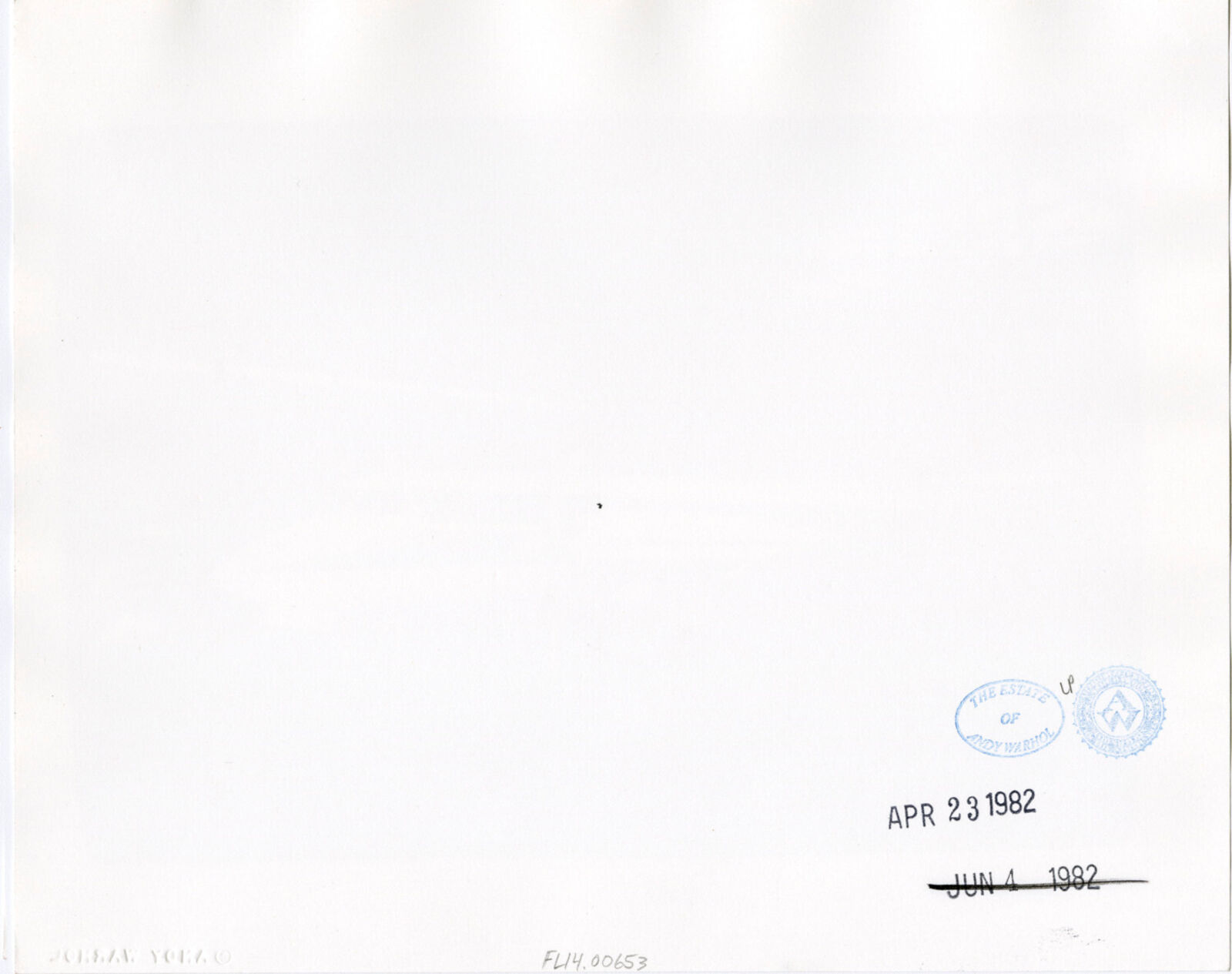 A black and white photo of an airplane in a hangar.