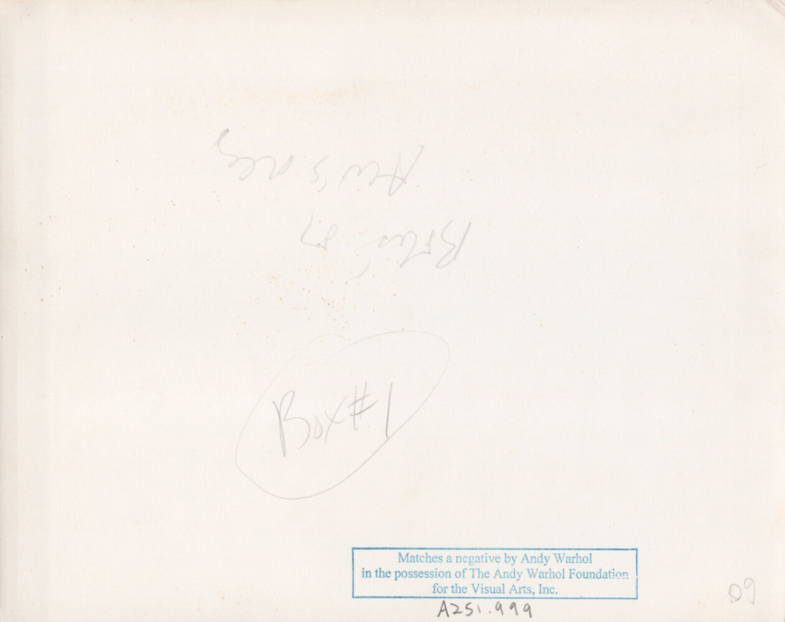 A black and white photo of a man and two women sitting on a couch.