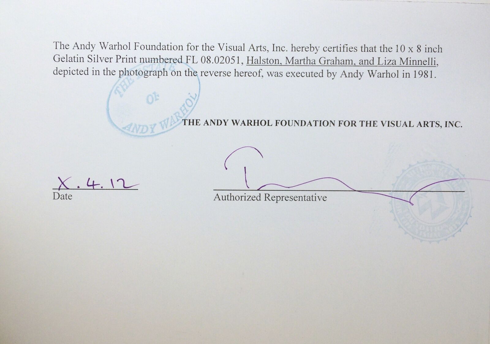 A black and white photo of two women and a man posing for a picture.